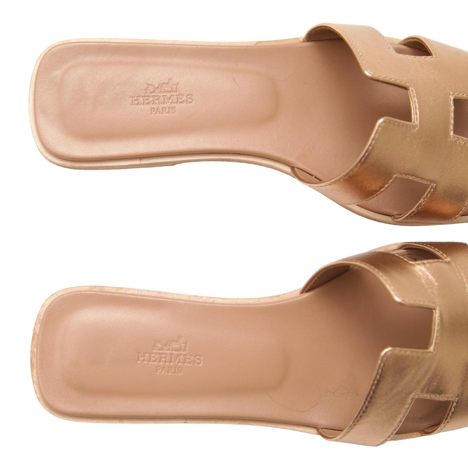 HERMES Oran Leather Sandal Rose Gold Metallic H Flat Slide Sz 38 5