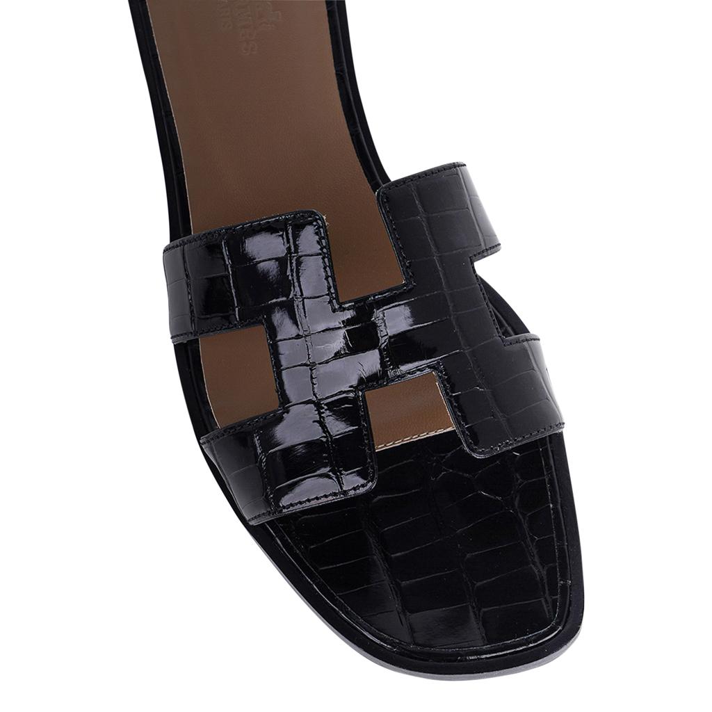 Mightychic offers Hermes Oran Sandals featured in Black Alligator.
The iconic H cutout over the top of the foot.
Classic and timeless. 
Wood heel with leather sole. 
Comes with sleepers, signature Hermes box and ribbon. 
NEW or NEVER WORN.
final