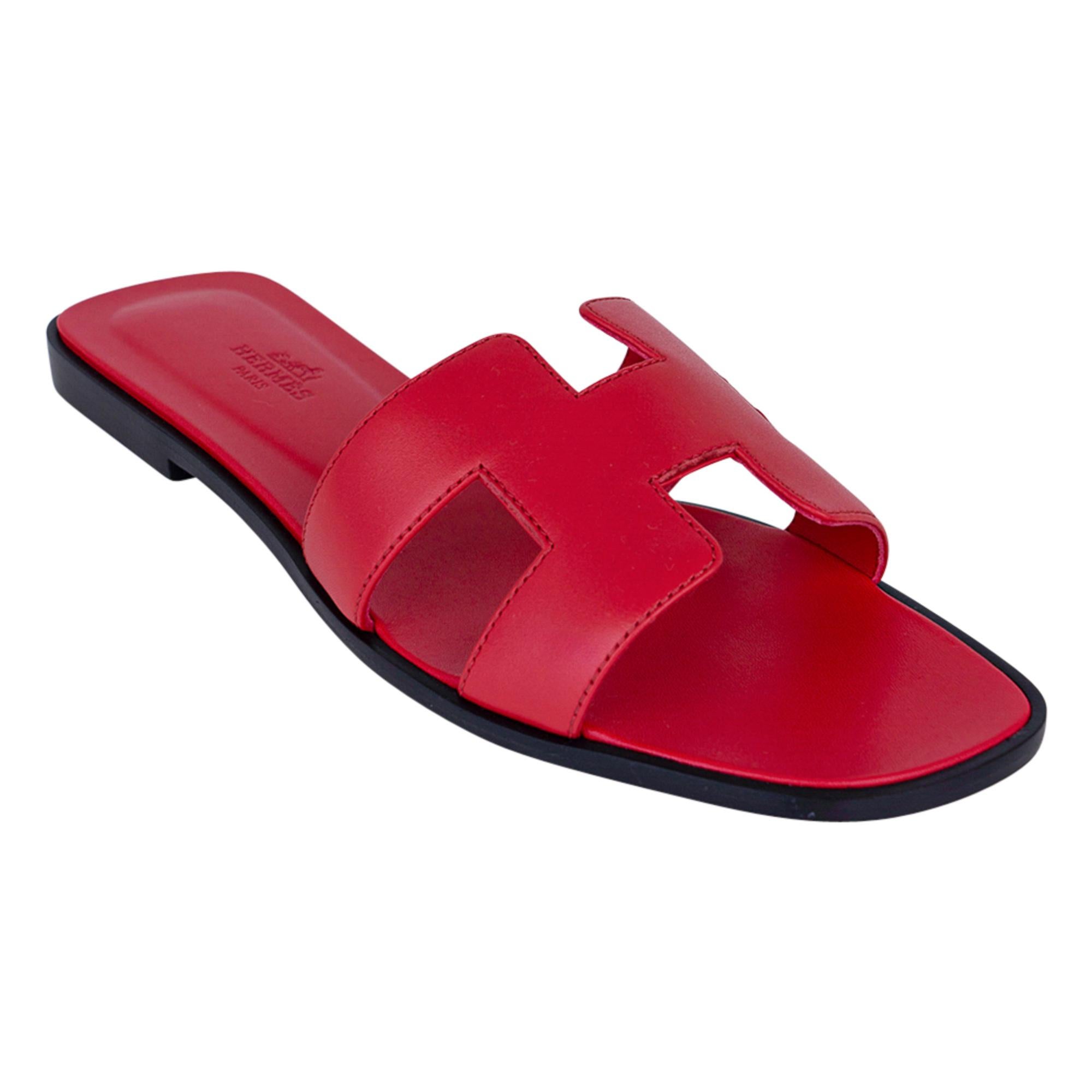 Guaranteed authentic Hermes Oran vibrant Rose Cotinga pink flat sandal.
These rich, saturated pink slides are a must for foot flirting!
Hermes Paris embossed leather insole. 
Wood heel with leather sole. 
Comes with sleepers and and signature Hermes