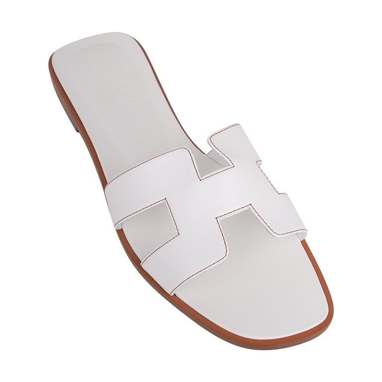 Hermes Oran Sandal White Calfskin Havane Topstitch 37 / 7 For Sale at  1stDibs | hermes oran sandals, h sandals, oran sandals hermes