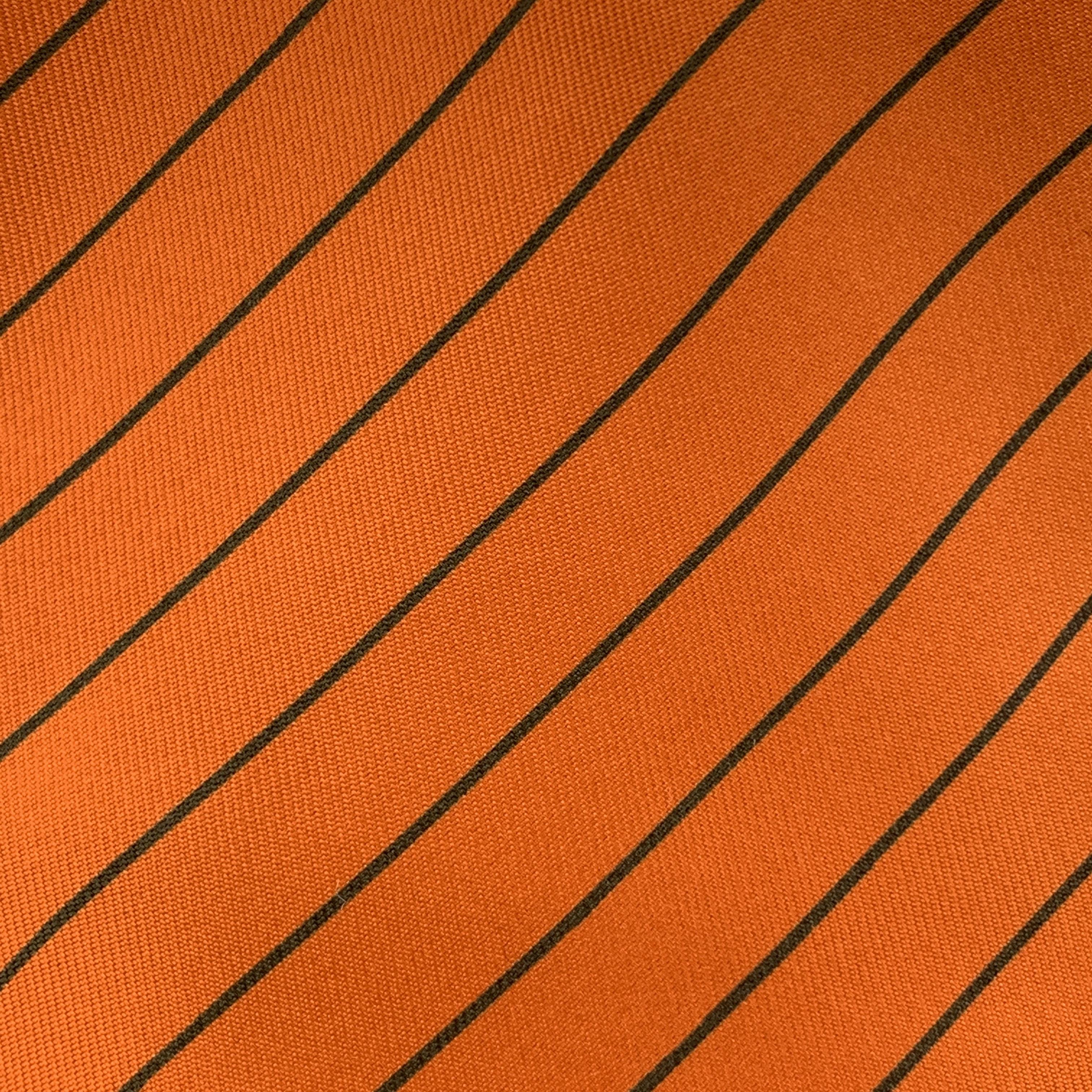 HERMES necktie comes in orange silk twill with all over charcoal diagonal stripe print. Made in France.

Excellent Pre-Owned Condition.

Width: 3.75 in. 