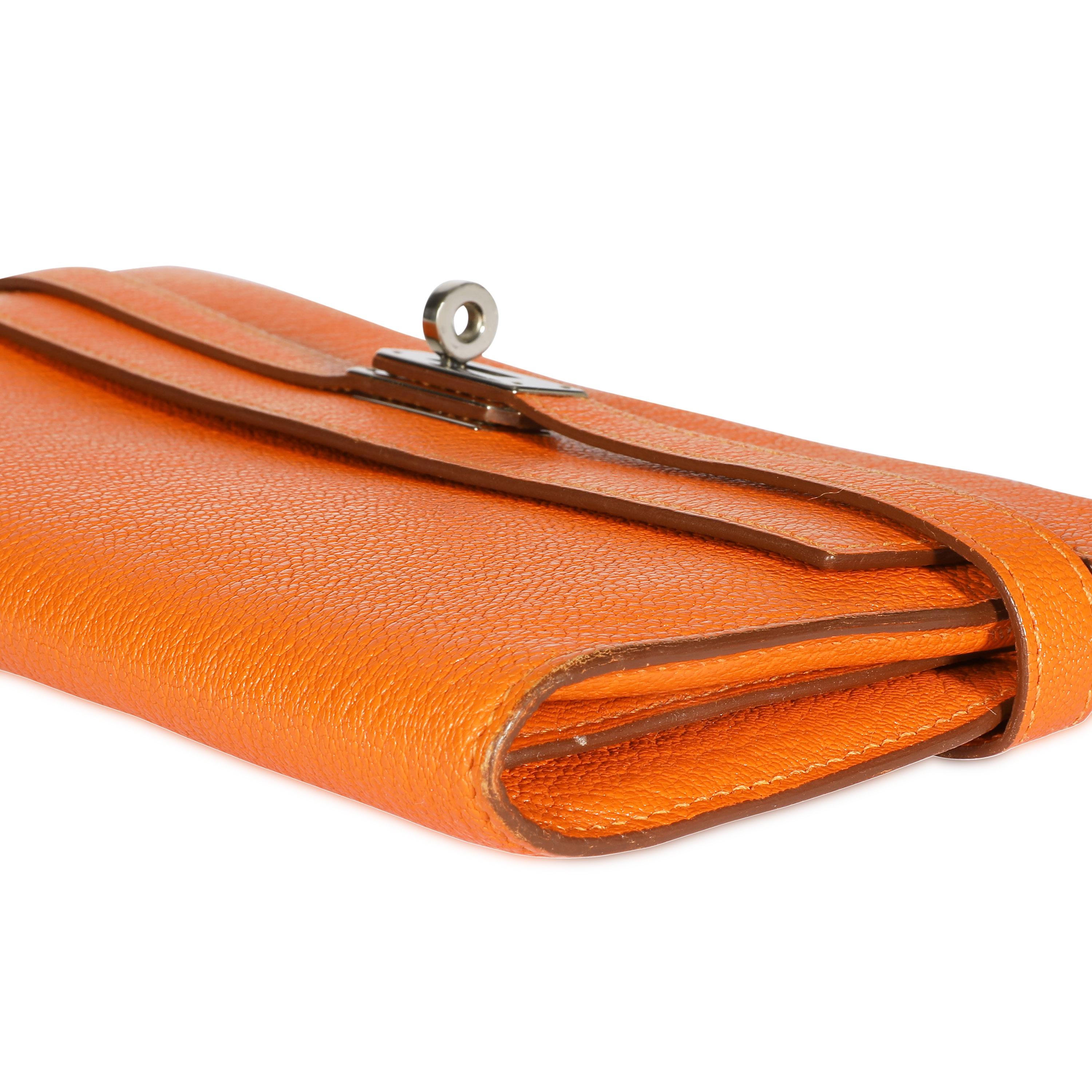 Listing Title: Hermès Orange Chévre Mysore Kelly Wallet with Palladium Hardware
SKU: 107815
MSRP: USD 3,675.00
Condition: Pre-owned (3000)
Condition Description: The Kelly wallet is the ultimate accessory. Crafted in Chévre leather in the iconic