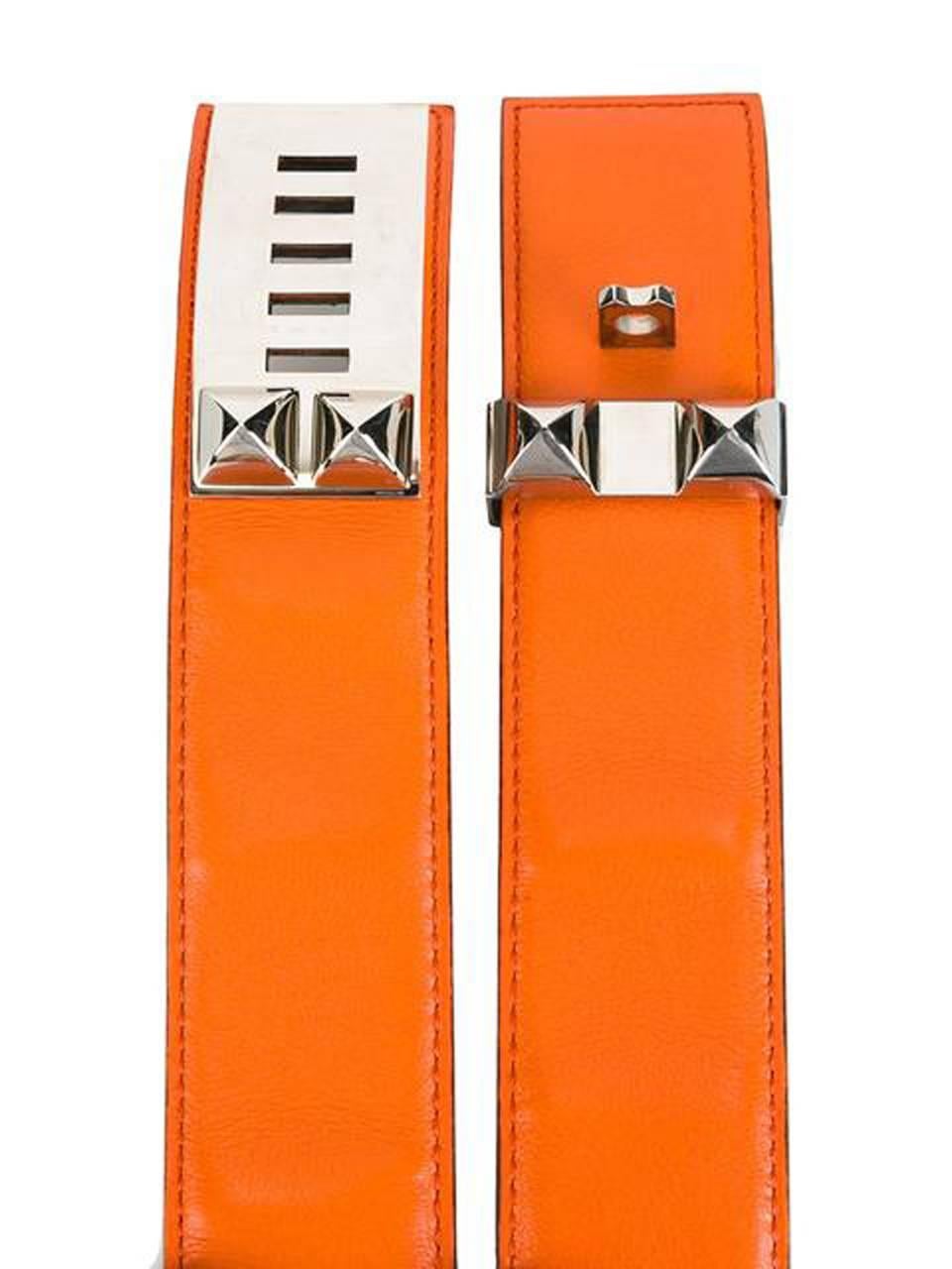 Gorgeous orange calfskin leather Hermès and  palladium-plated stud detail belt  featuring palladium-plated hardware and an internal logo stamp, with palladium-plated  Collier de Chien buckle.
Width: 1,5in. (4cm)
Maxi Length: 32.6in. (83cm)
In good