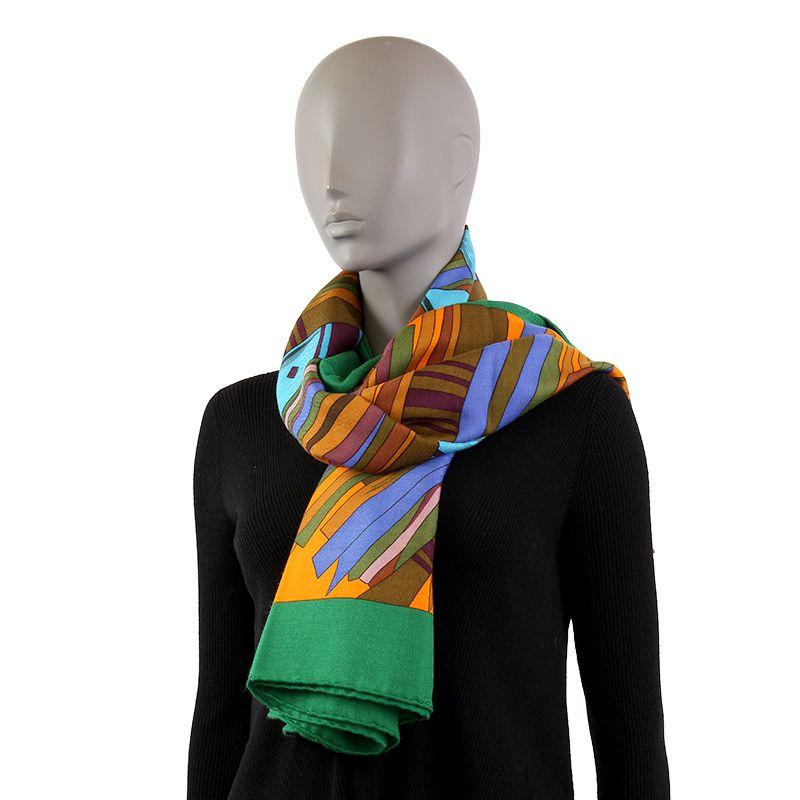 Hermes 'Cuirs du Desert Details' shawl in orange cashmere (65%) and silk (35%) with Kelly green border and details in olive, khaki, dusty rose, mustard, royal blue and cerulean blue. Brand new.

Width 140cm (54.6in)
Height 140cm (54.6in)
