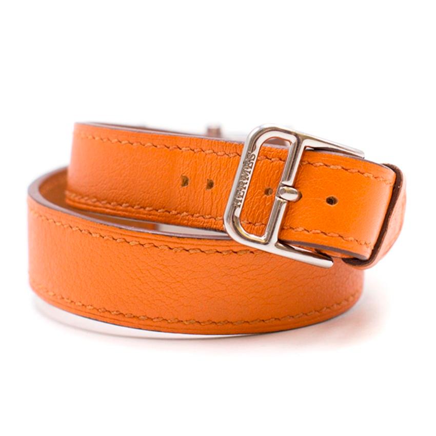 Hermès Orange Double-Strap Watch

-Orange wrap-around straps 
-Silver-tone hardware

Please note, these items are pre-owned and may show signs of being stored even when unworn and unused. This is reflected within the significantly reduced price.
