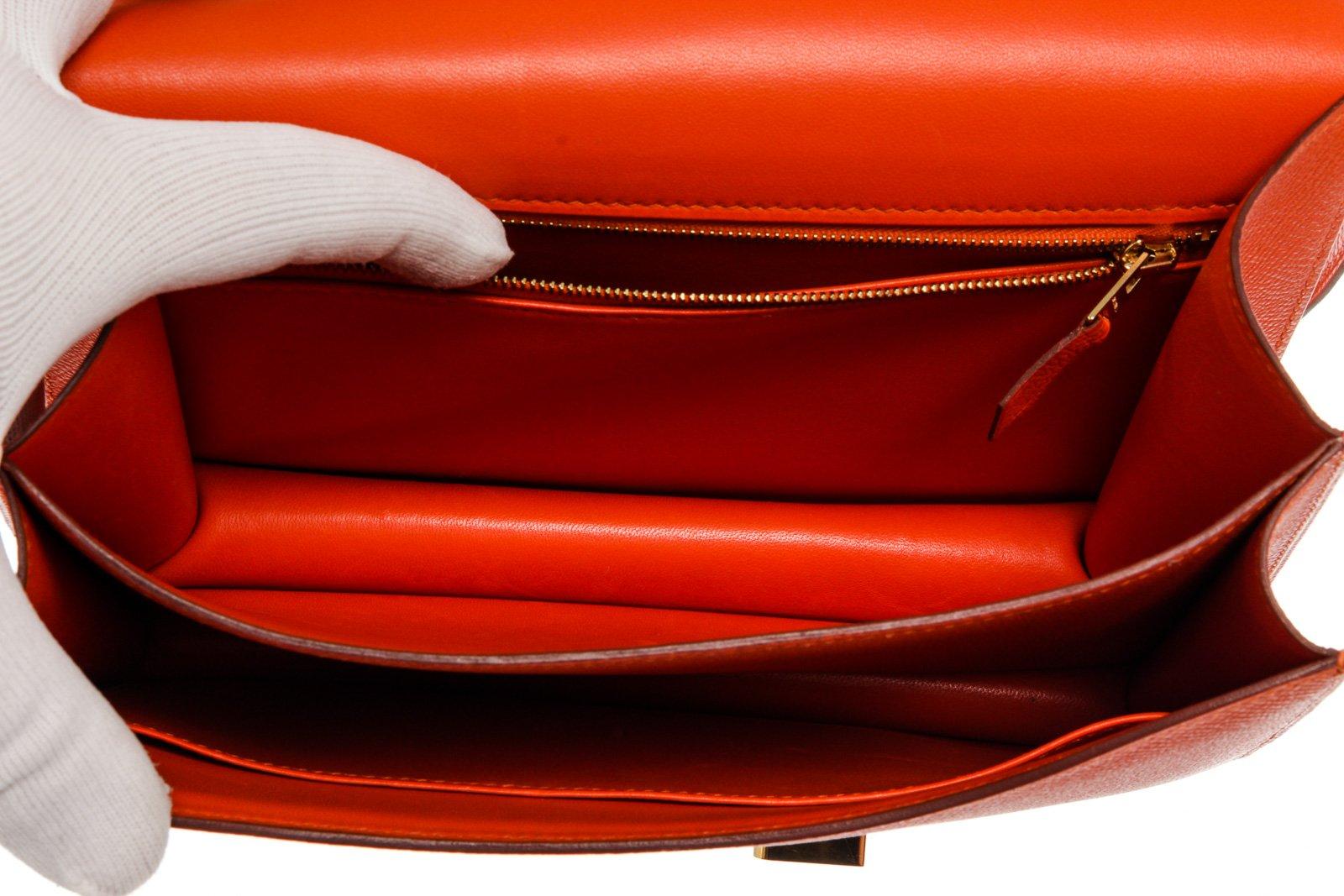 Hermes Orange Epsom Leather Constance 24cm Shoulder Bag with leather, gold-tone hardware, interior slip zip pocket, shoulder strap and snap closure.

55065MSC