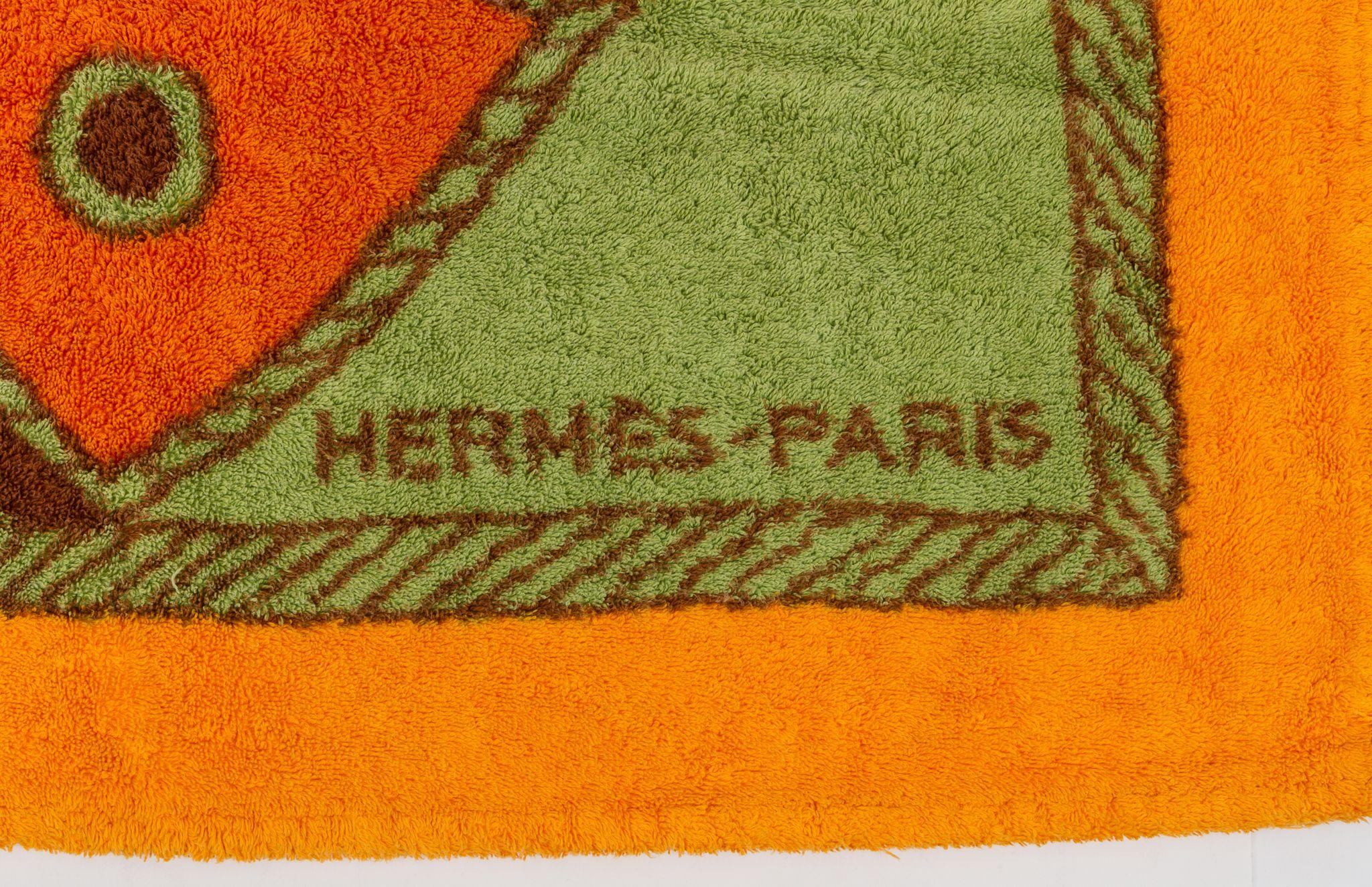 Hermès beach towel with fish design. Orange and green color combination. 100% cotton.