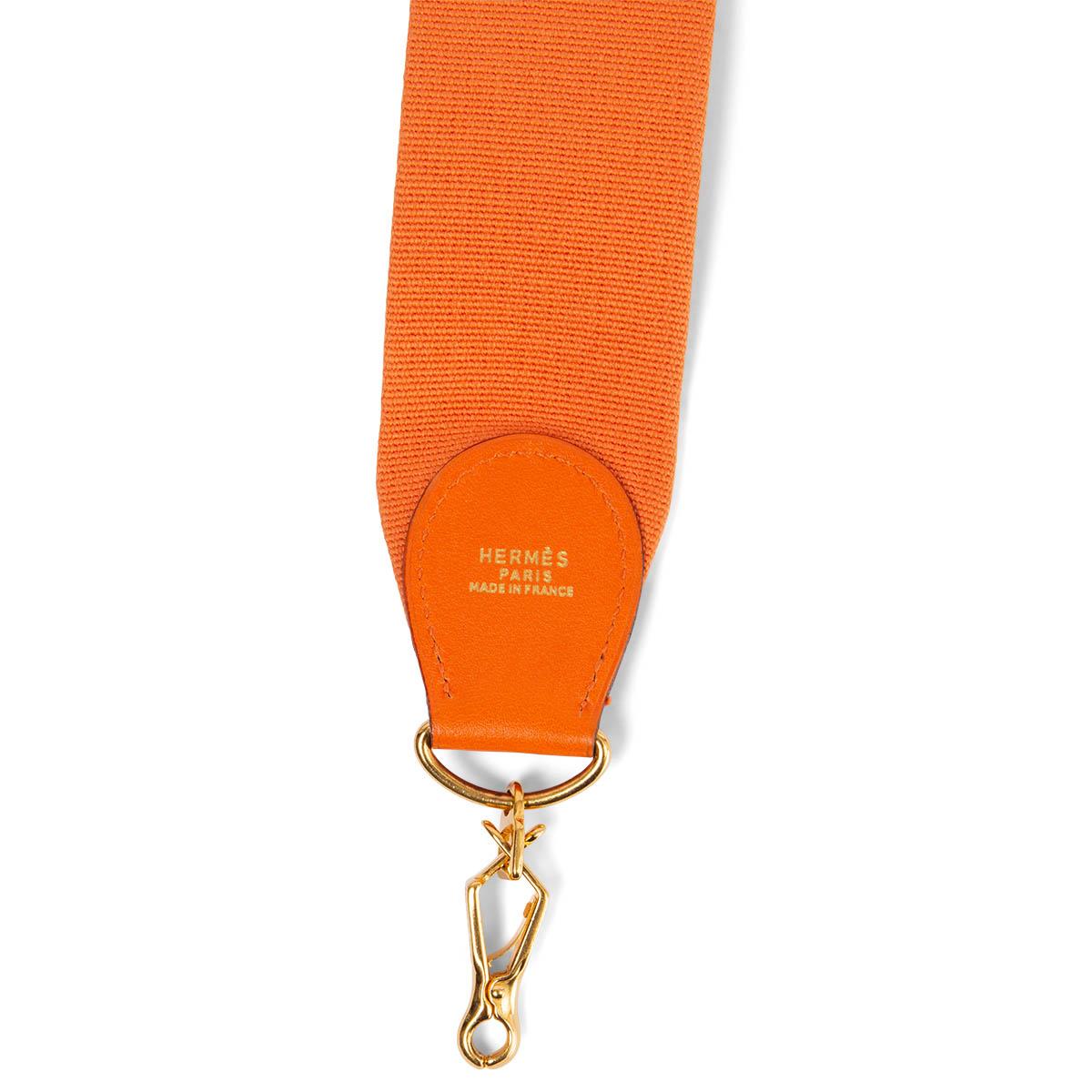 100% authentic Hermès shoulder strap for your Kelly or Evelyne bag in orange canvas and Gulliver leather. Has been carried and is in excellent condition.

Measurements
Width	5cm (2in)
Length	110cm (42.9in)
Hardware	Gold-Tone

All our listings