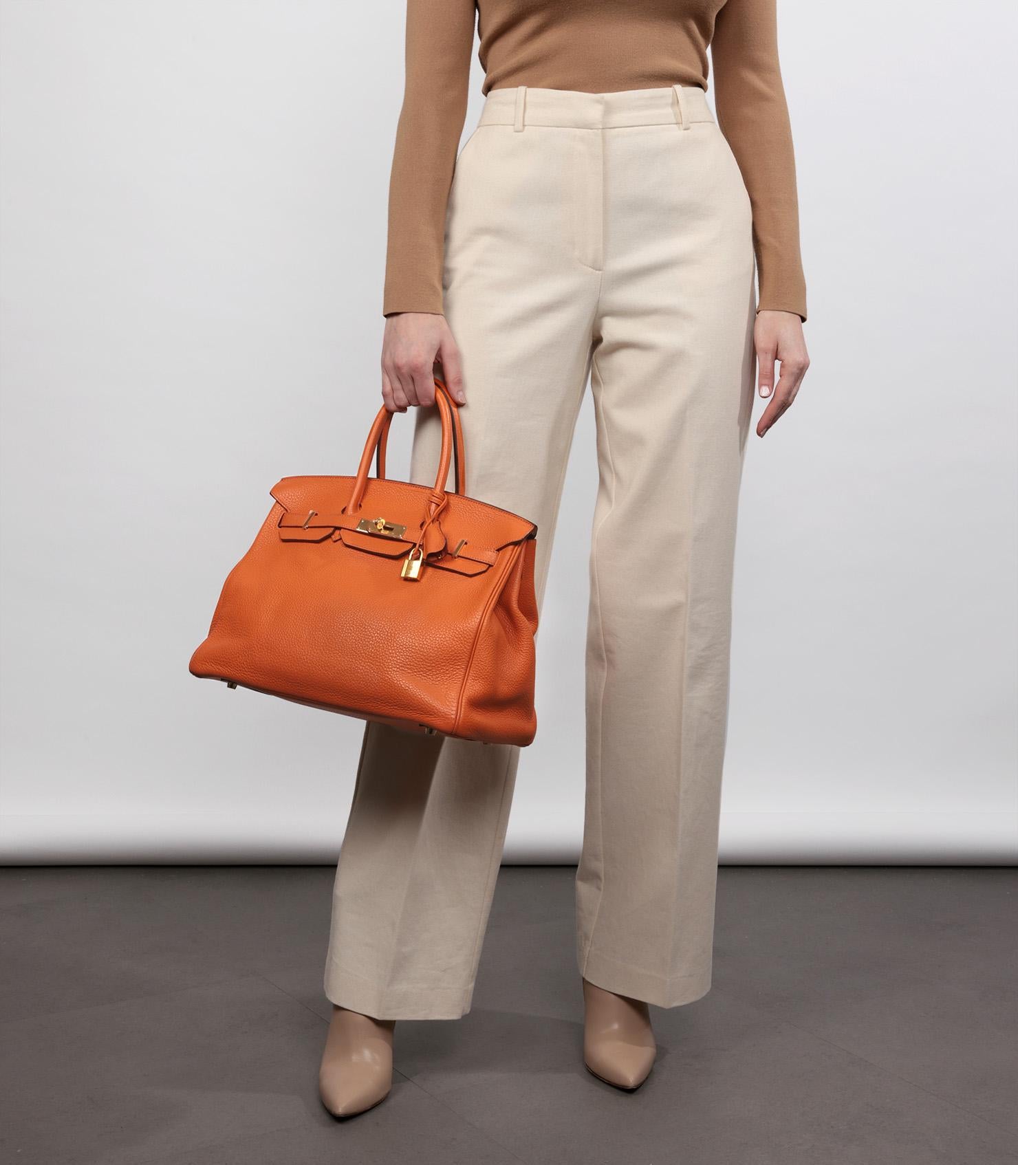 Hermès Orange H Clemence Leather Birkin 35cm Retourne

Brand- Hermès
Model- Birkin 35cm
Product Type- Tote
Serial Number- [R*
Age- Circa 2014
Accompanied By- Hermès Dust Bag, Padlock, Keys, Clochette, Small Dust Bag
Colour- Orange H
Hardware-