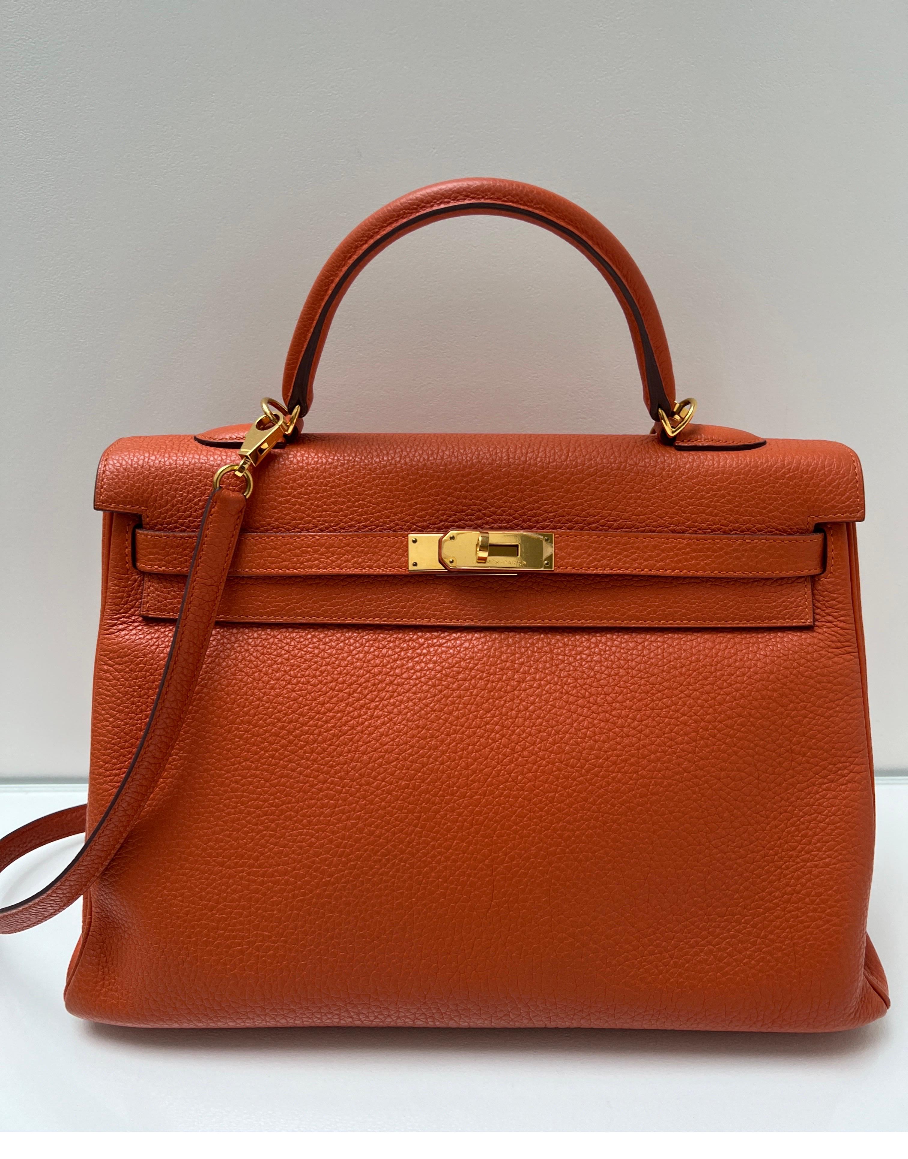 Hermes Orange Kelly 35 Bag. Excellent condition. Gold hardware. Togo leather. Interior clean. Classic Hermes orange color. Priced to sell. Kelly bags are back. Stamp P. Includes clochette, lock, keys, and dust bag. Guaranteed authentic. 