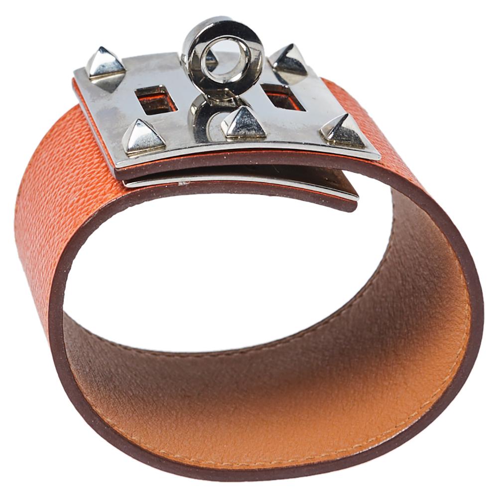 Hermès is well-known for its supreme craftsmanship and elegant designs. A famous design, this Kelly bracelet in orange leather is a prize to delight the style of luxurious women. This bracelet features palladium-plated hardware and the kelly twist