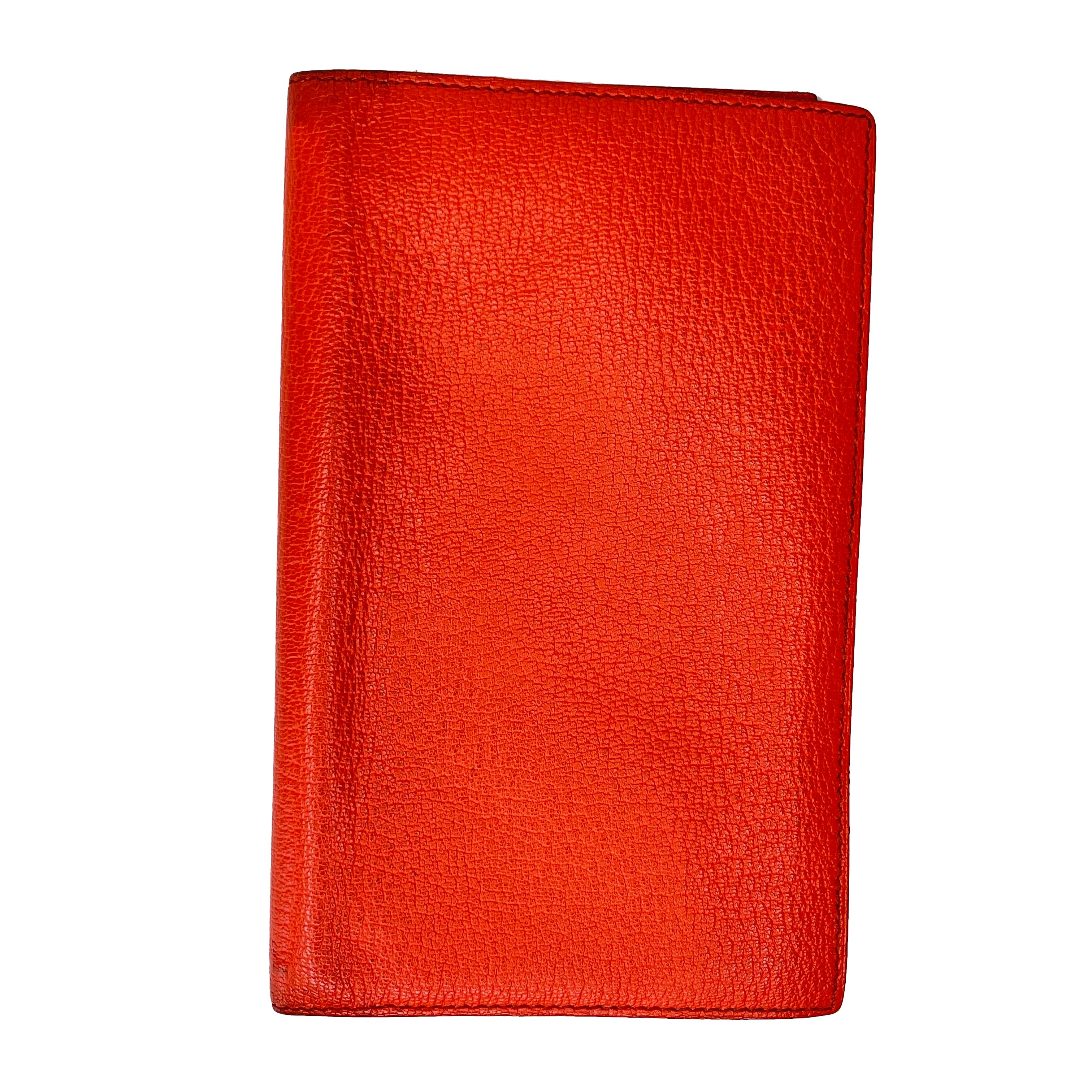 Agenda cover in Mysore goatskin with 2 pockets and a hook for refill. Please note we are happy to assist you in getting paper fitted for this binder.

COLOR: Orange
MATERIAL: Mysore goatskin
ITEM CODE: T AM 008 UH
MEASURES: L 6.75” x W 4” x D