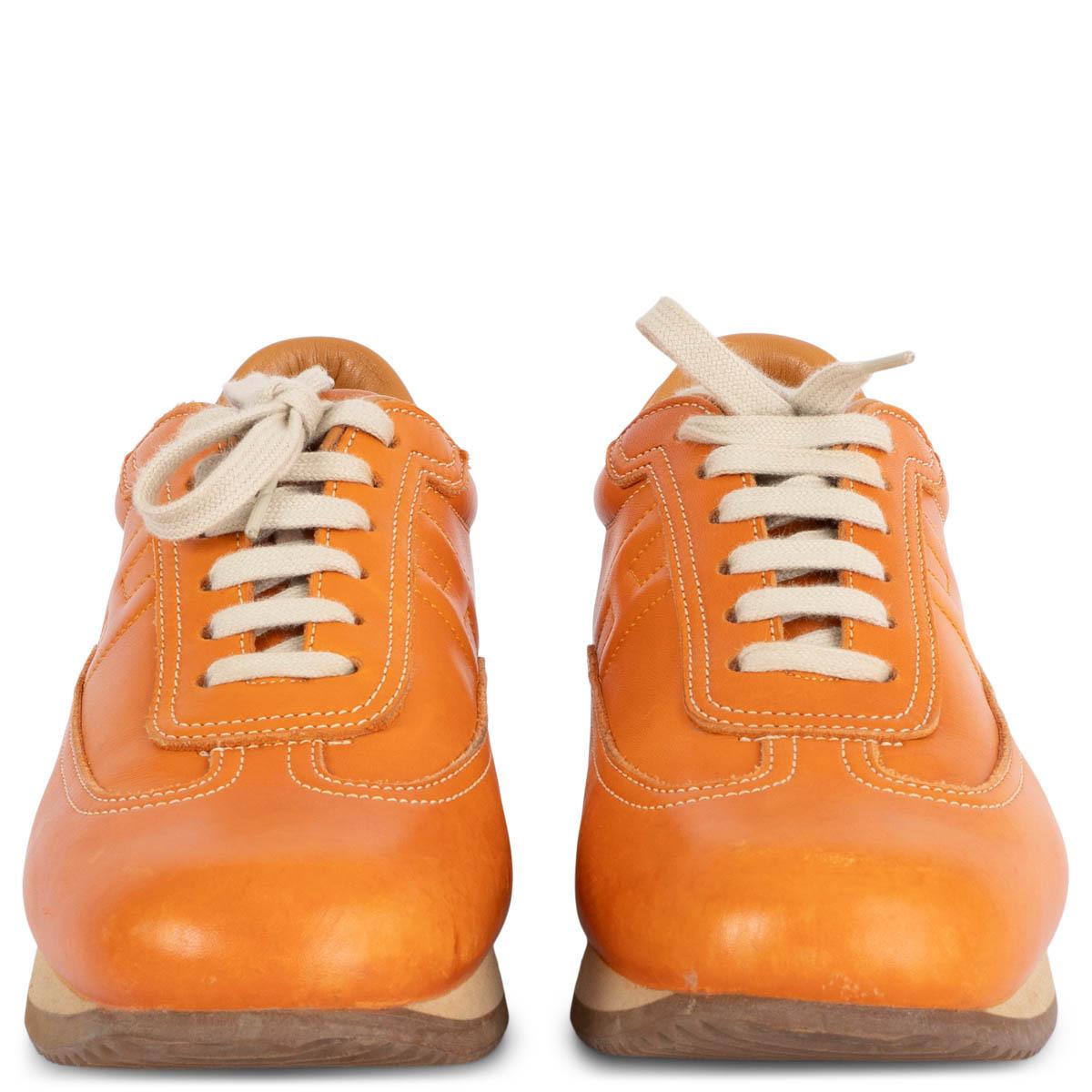 100% authentic Hermès Quick sneakers in smooth orange calfskin featuring beige rubber sole. Have been worn and show some soft patina to the leather. Overall in very good condition. 

Measurements
Imprinted Size	38
Shoe Size	38
Inside Sole	25cm