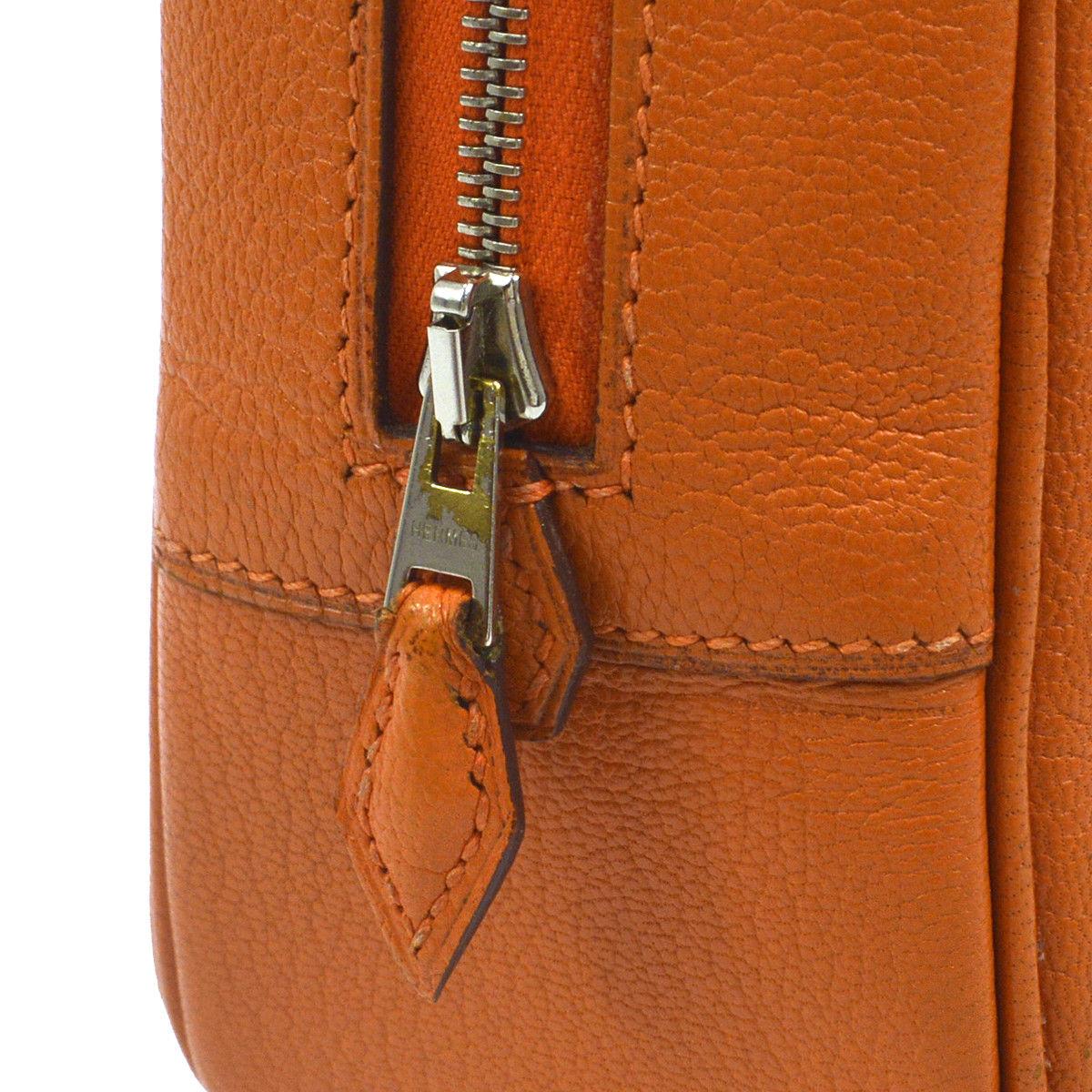 Hermes Orange Plume Leather Silver Small Top Handle Satchel Bag 

Leather
Silver tone hardware
Zipper closure 
Leather lining
Date code present 
Made in France
Handle 4.5