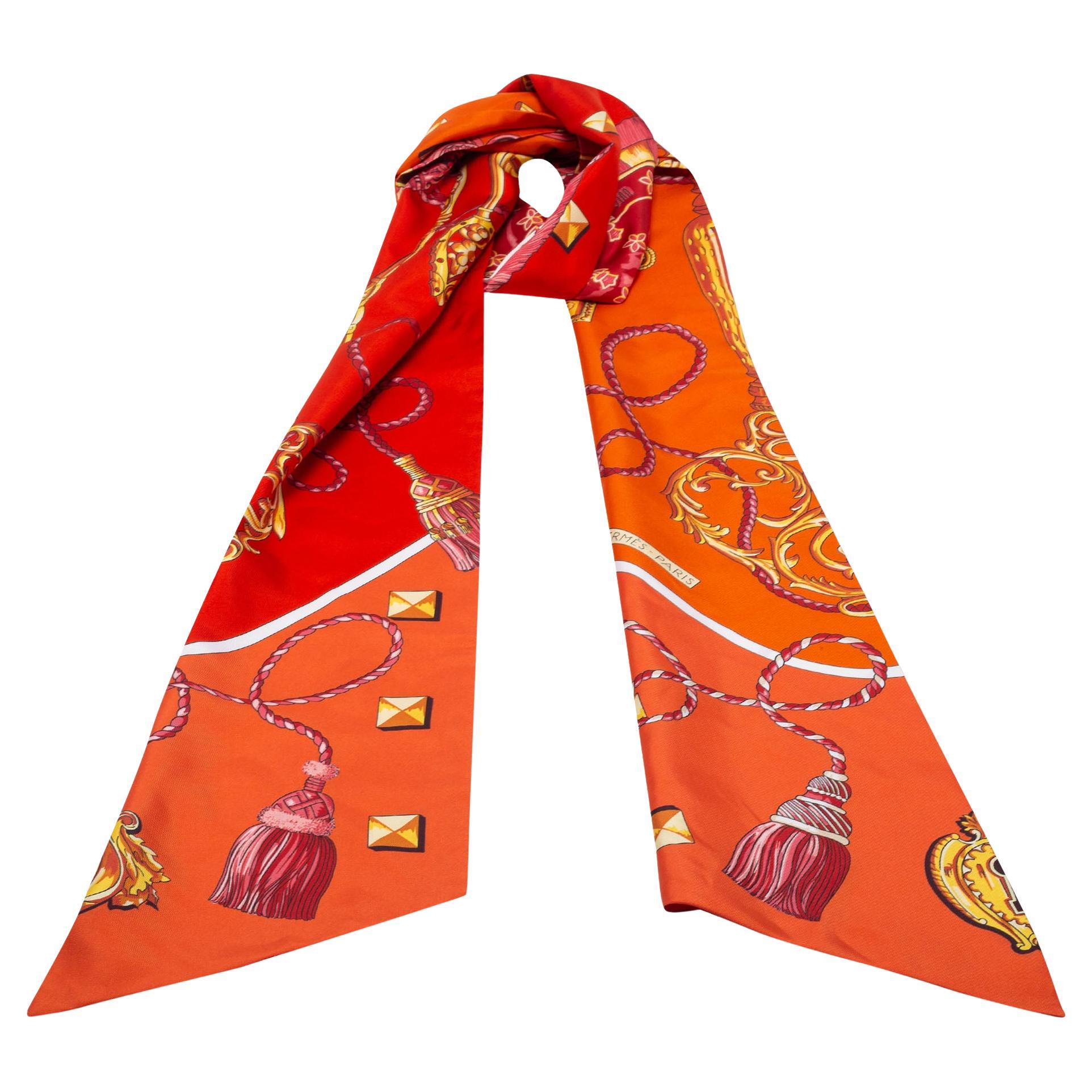 This fabulous twilly by Hermès complements almost all your outfits and looks pretty whether you tie it around your hair or your wrist. Cut from silk, this scarf is adorned all over with an interesting Les Clés print.

Includes: 
Original Box,
