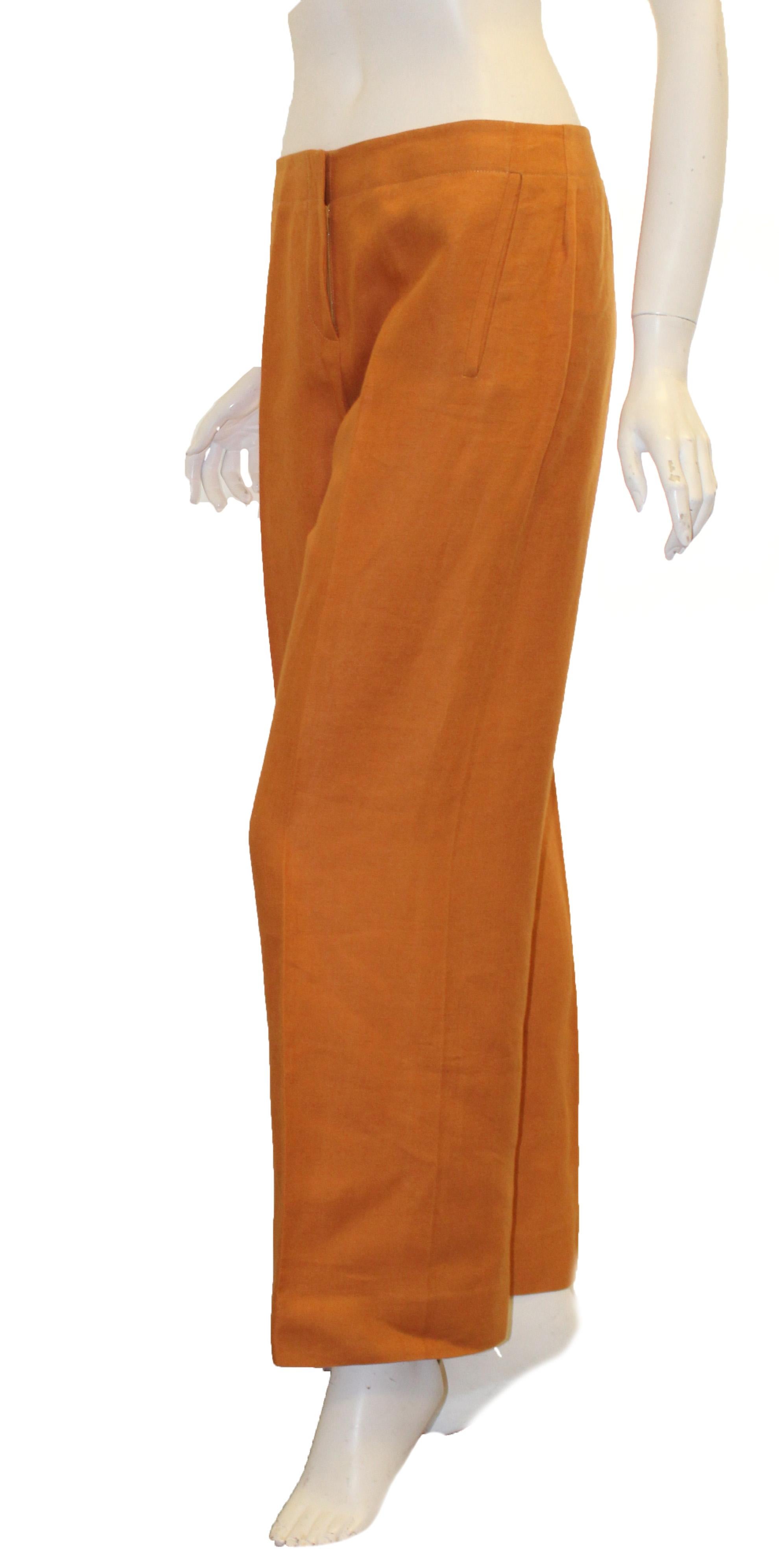 Hermes modern orange linen wide leg fit pants full length incorporates front zipper closure with single button.   These pants are not lined.   Pants in excellent condition.  Made in France. 