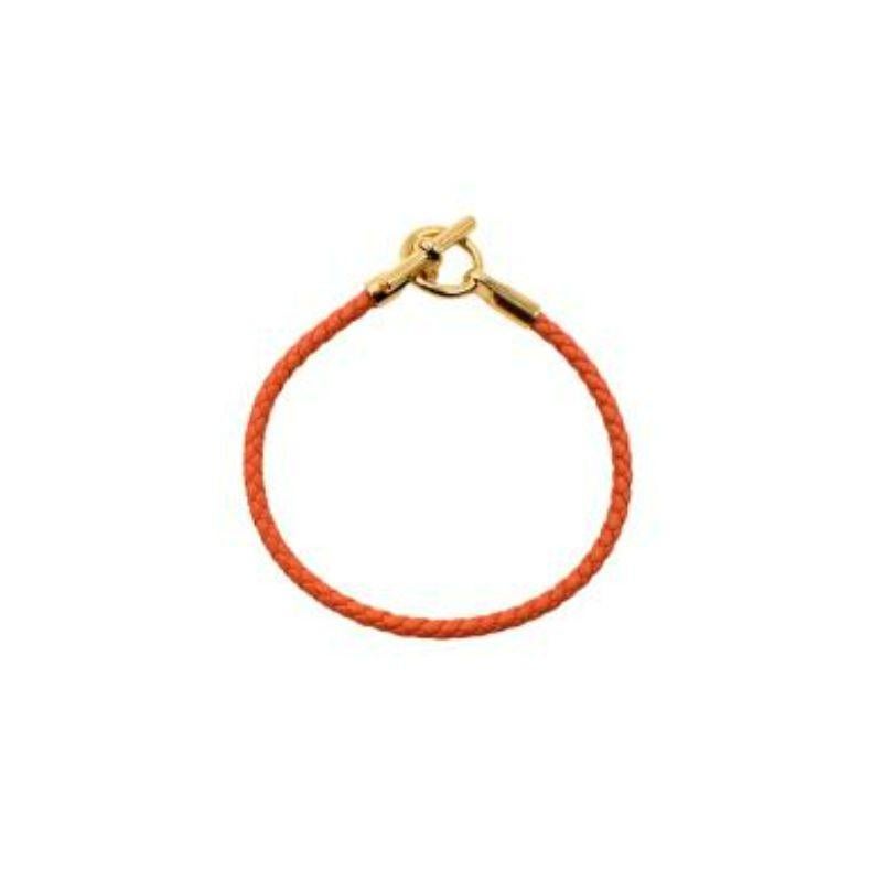 Hermes Orange Minium Glenan Bracelet

- Braided Bracelet 
- Gold-Plated Glenan Clasp
- Iconic Hermes orange color

Material:
Swift Calfskin
Gold-Plated Hardware

Made in Italy.

PLEASE NOTE, THESE ITEMS ARE PRE-OWNED AND MAY SHOW SIGNS OF