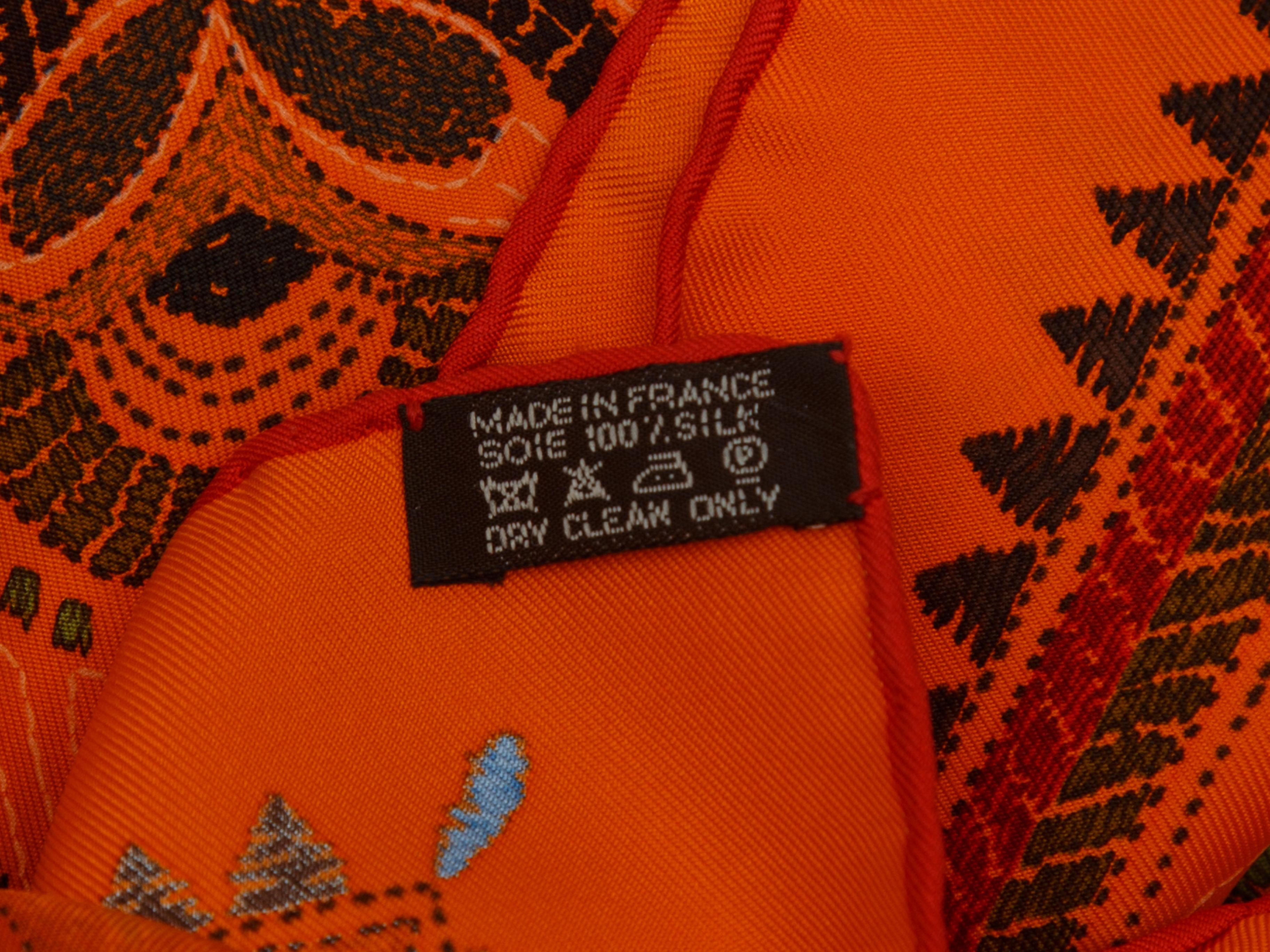 Product details: Orange and multicolor 'Carré Kantha' silk scarf by Hermes. Animal print throughout. 35
