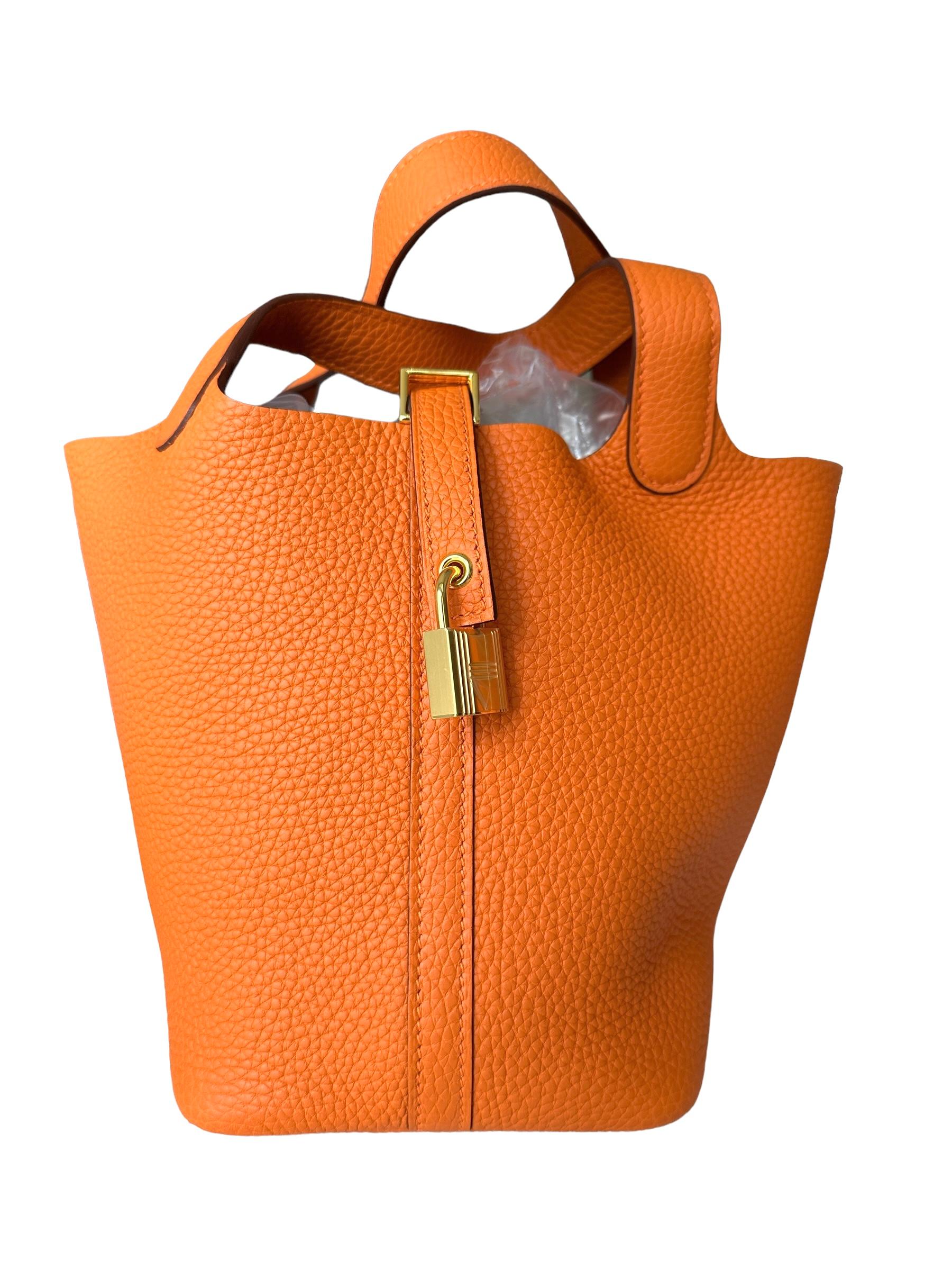 Hermes
Hermes Picotin Lock 18cm of Orange clemence leather with gold hardware.
Yes Hermes Orange is Back!
Hermes Signature Color, you cant go wrong
Gold plated hardware
So hard to get 
The Hermès Picotin 18 is a small handbag from the French luxury