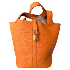 Hermès - Sac Picotin Lock orange 18 cm avec accessoires dorés