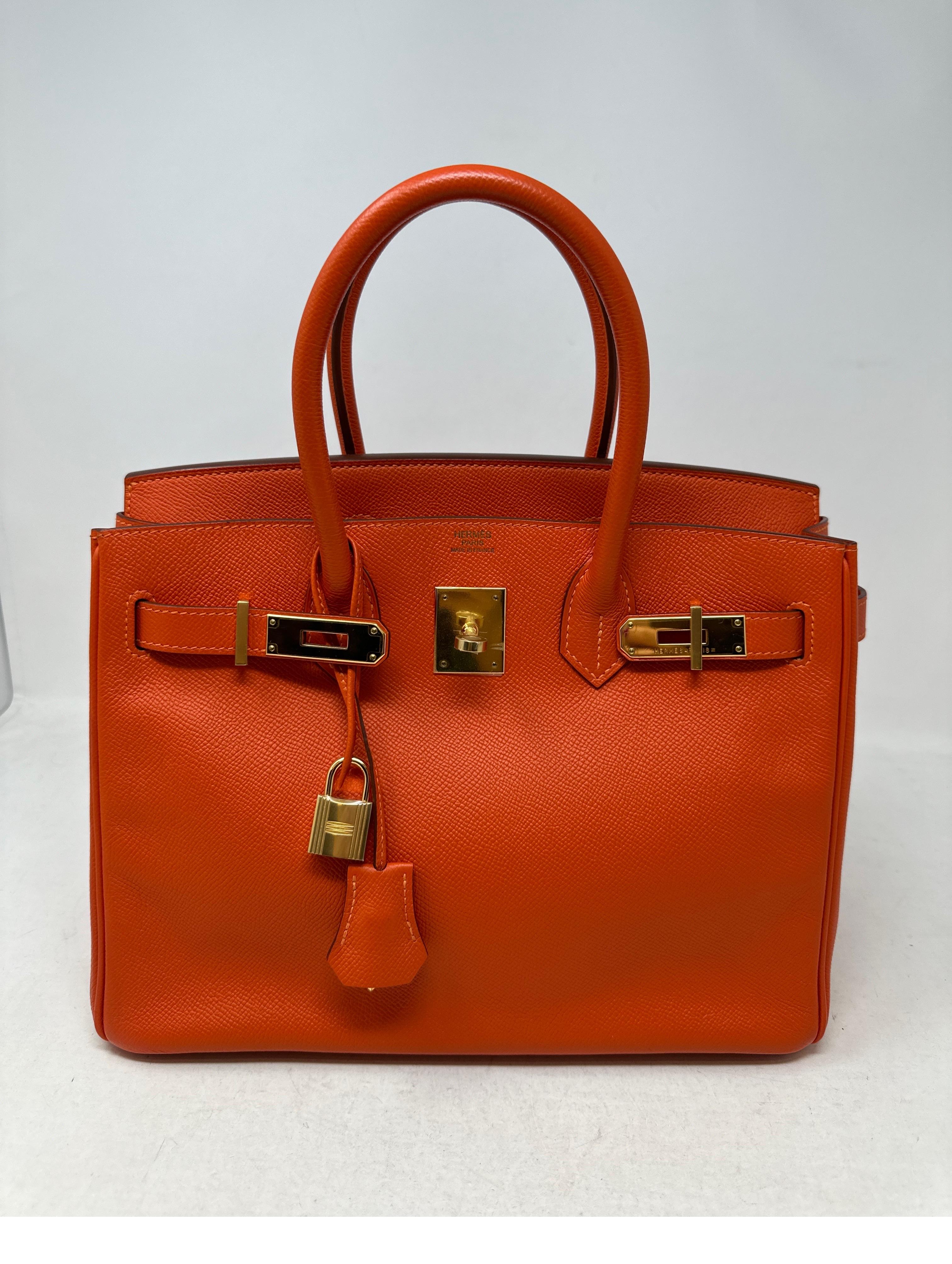 Hermes Poppy Orange Birkin 30 Bag. Epsom leather. Gold hardware. Vibrant orange color. Excellent condition. Plastic still on hardware. O stamp. Interior clean. Includes clochette, lock, keys, and dust bag. Guaranteed authentic. 