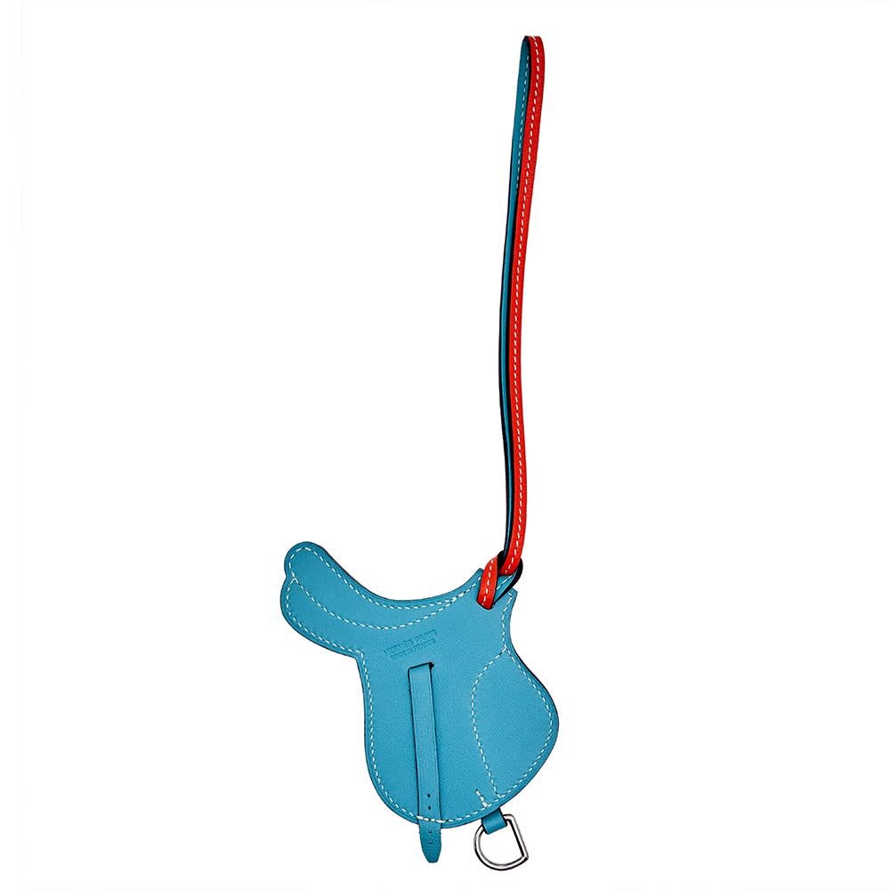 Hermes pays homage to its equestrian design heritage with this bag charm. This Paddock Selle Saddle charm is cut from leather and has two colors. It can be hung on your prized bags. The charm is made in France.


