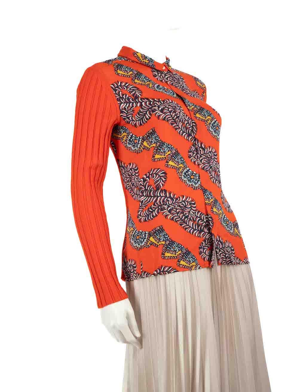 CONDITION is Very good. Hardly any visible wear to the top is evident on this used Hermès designer resale item.
 
 Details
 Orange
 Silk
 Top
 Abstract print front panel
 Knitted sleeves and back
 Button up fastening
 
 
 Made in Italy
 
