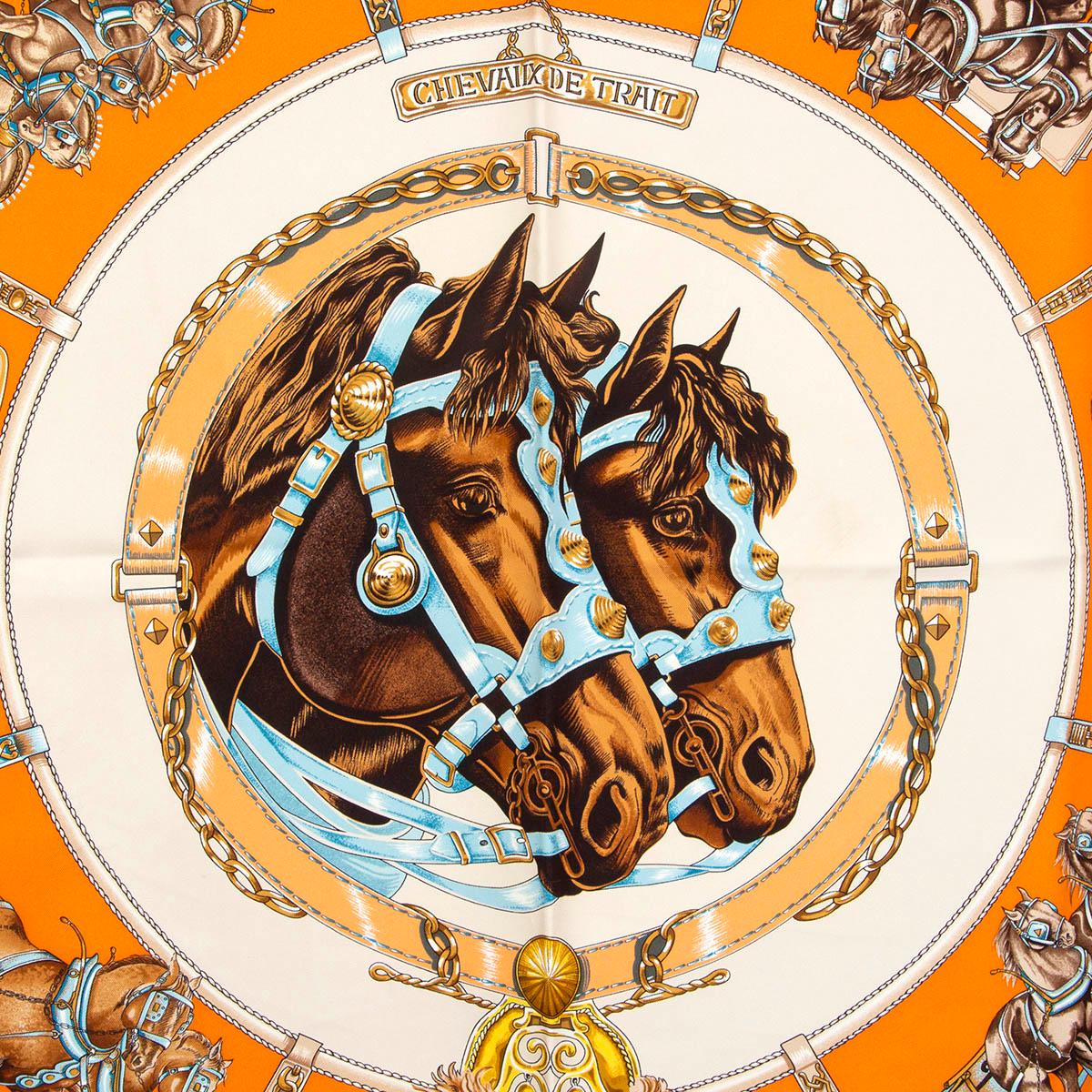100% authentic Hermès Chevaux de Trait 90 scarf in orange silk twill (100%) with details in gold, light blue and brown. Has been worn and is in excellent condition. First issue in 1993.

Measurements
Width	90cm (35.1in)
Height	90cm (35.1in)

All our