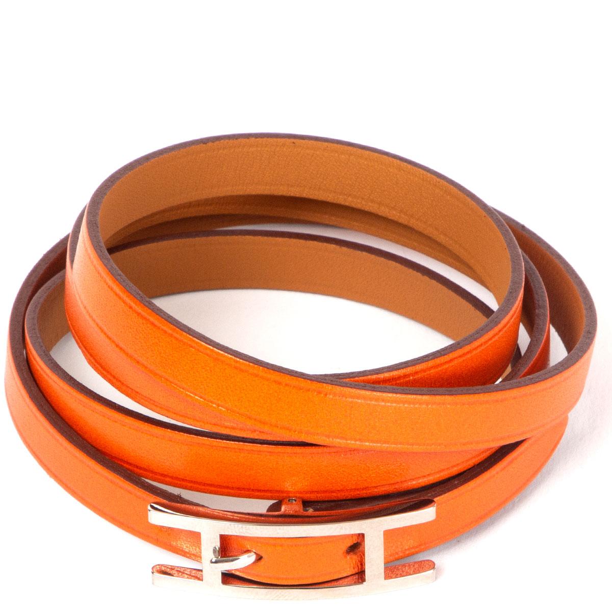 100% authentic Hermes 'Hapi 4' bracelet orange Swift with Palladium hardware. Has been worn and is in excellent condition. Comes with dust bag. 

Measurements
Width	0.7cm (0.3in)
Length	75cm (29.3in)
Fits	68cm (26.5in) to 70cm