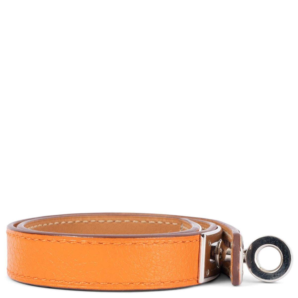 100% authentic Hermès Kelly Double Tour wrap bracelet in orange Swift leather with palladium plated Kelly closure. Has been worn and is in excellent condition. Comes with box. 

Measurements
Tag Size	S
Size	S
Width	1.3cm (0.5in)
Length	37cm