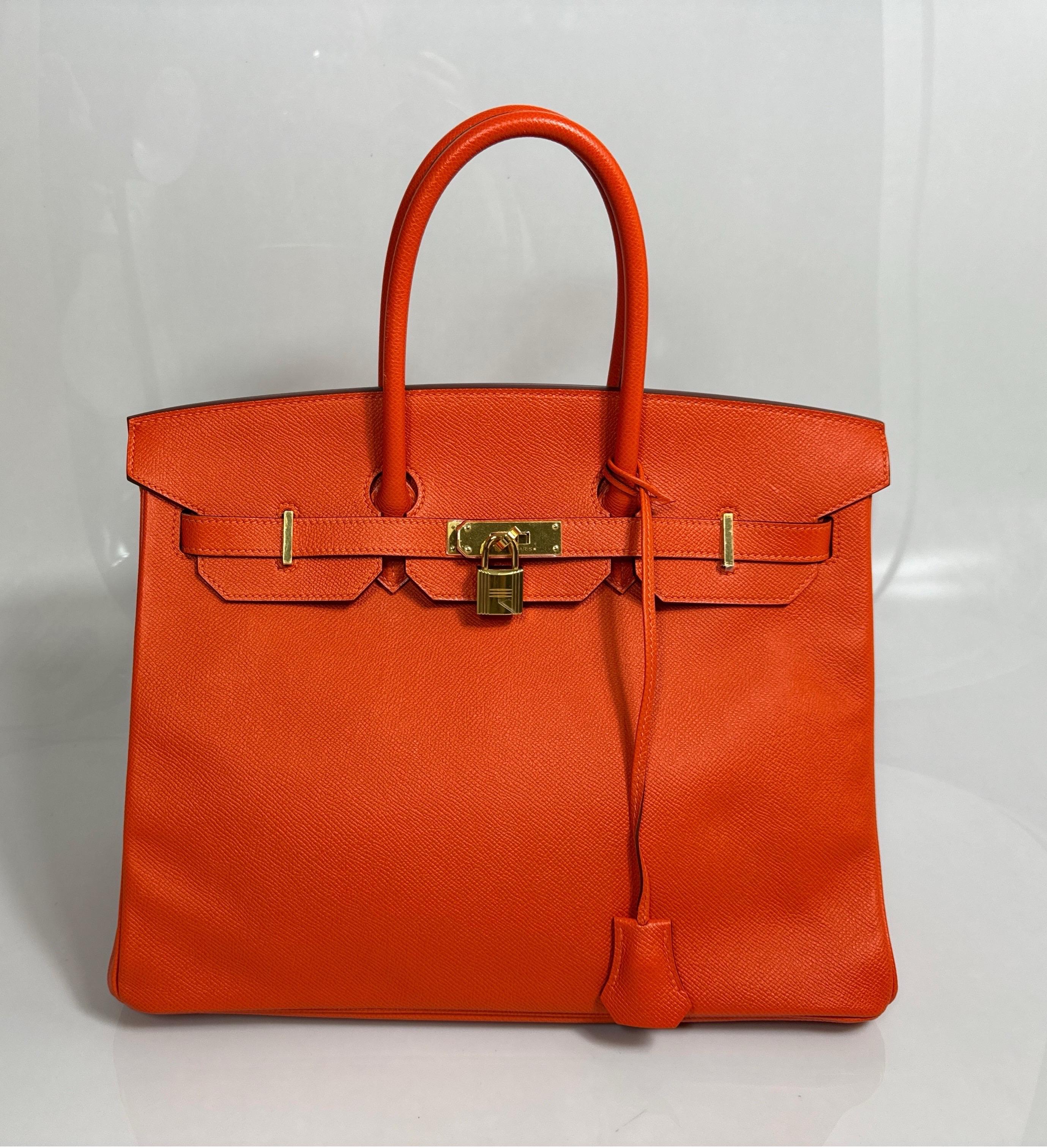 Hermes Orange Togo 35cm Birkin - 2016 - GHW - NEW This Birkin is new and never carried although it was purchased in 2016. The 35cm iconic Birkin is in Hermes signature Orange Togo leather with gold hardware and has tonal stitching, a front toggle