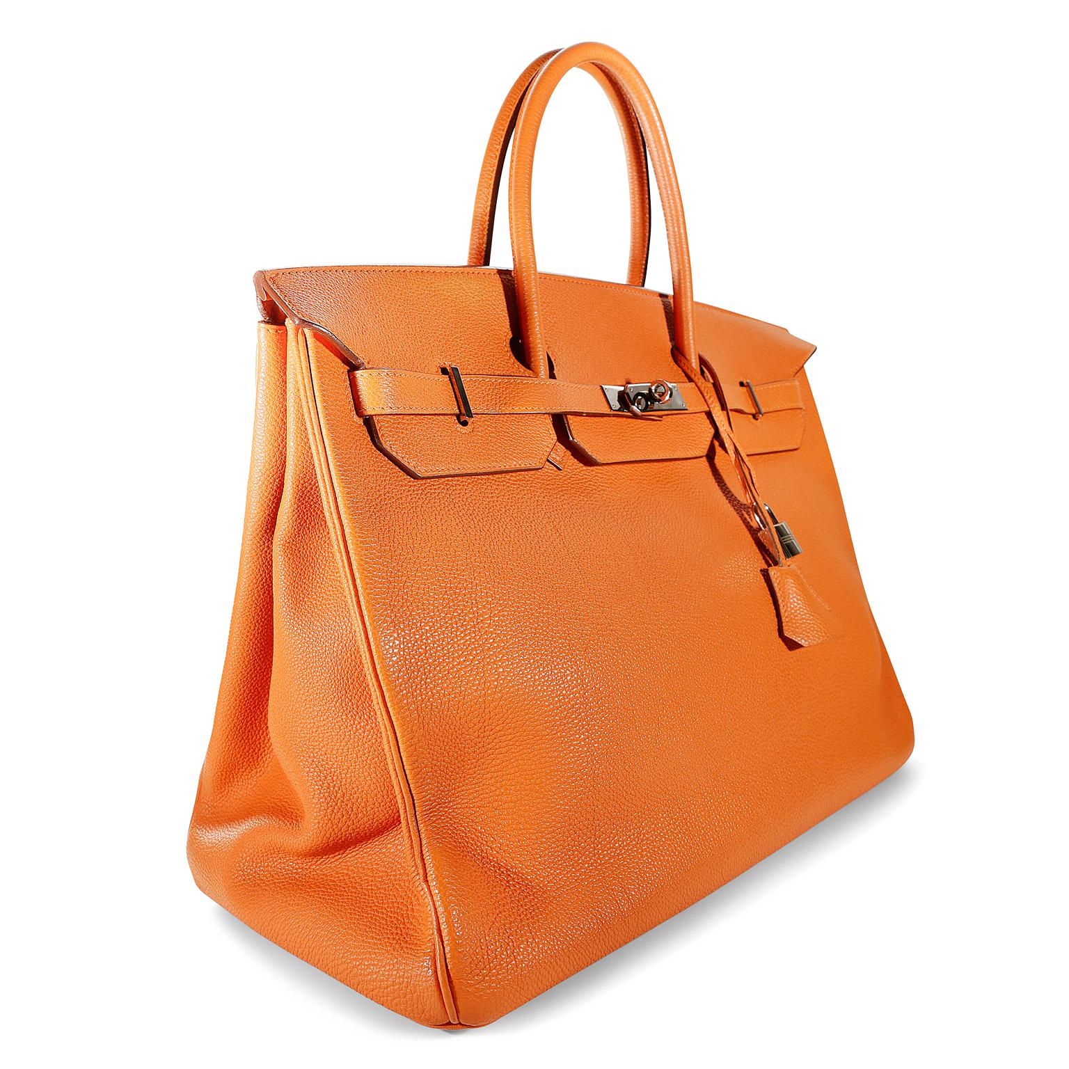 Hermès Orange Togo 40 cm Birkin- excellent condition
Hand stitched by skilled craftsmen, wait lists of a year or more are common for the Hermès Birkin. They are considered the ultimate in luxury fashion. Iconic Orange paired with Palladium hardware