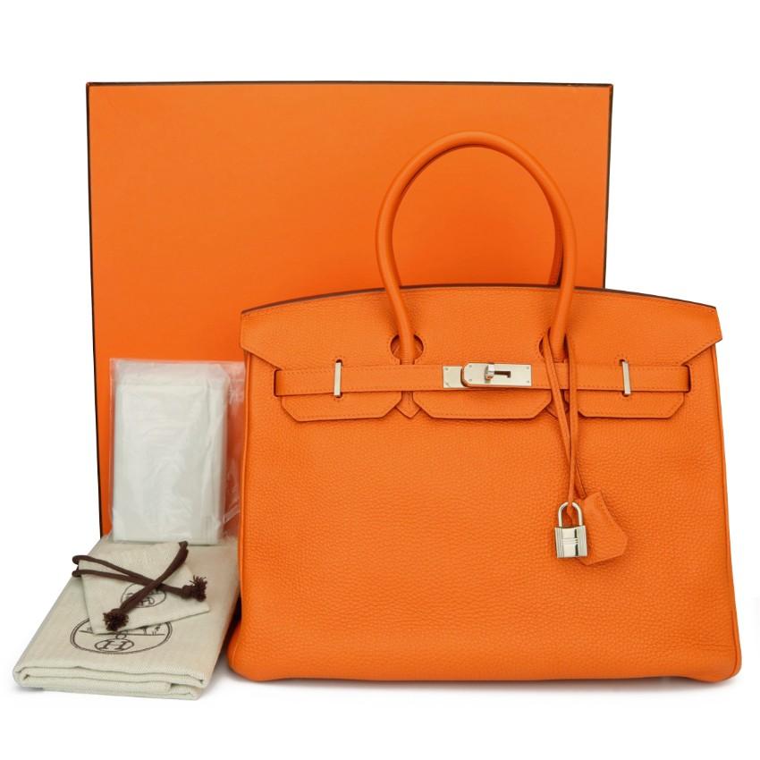 Hermes Birkin Bag 35cm Orange Togo Leather with Palladium Hardware Stamp N_Year 2010

This bag is still in excellent-mint condition. The bag still holds to the shape well. The hardware still very shiny and covered by the original protective