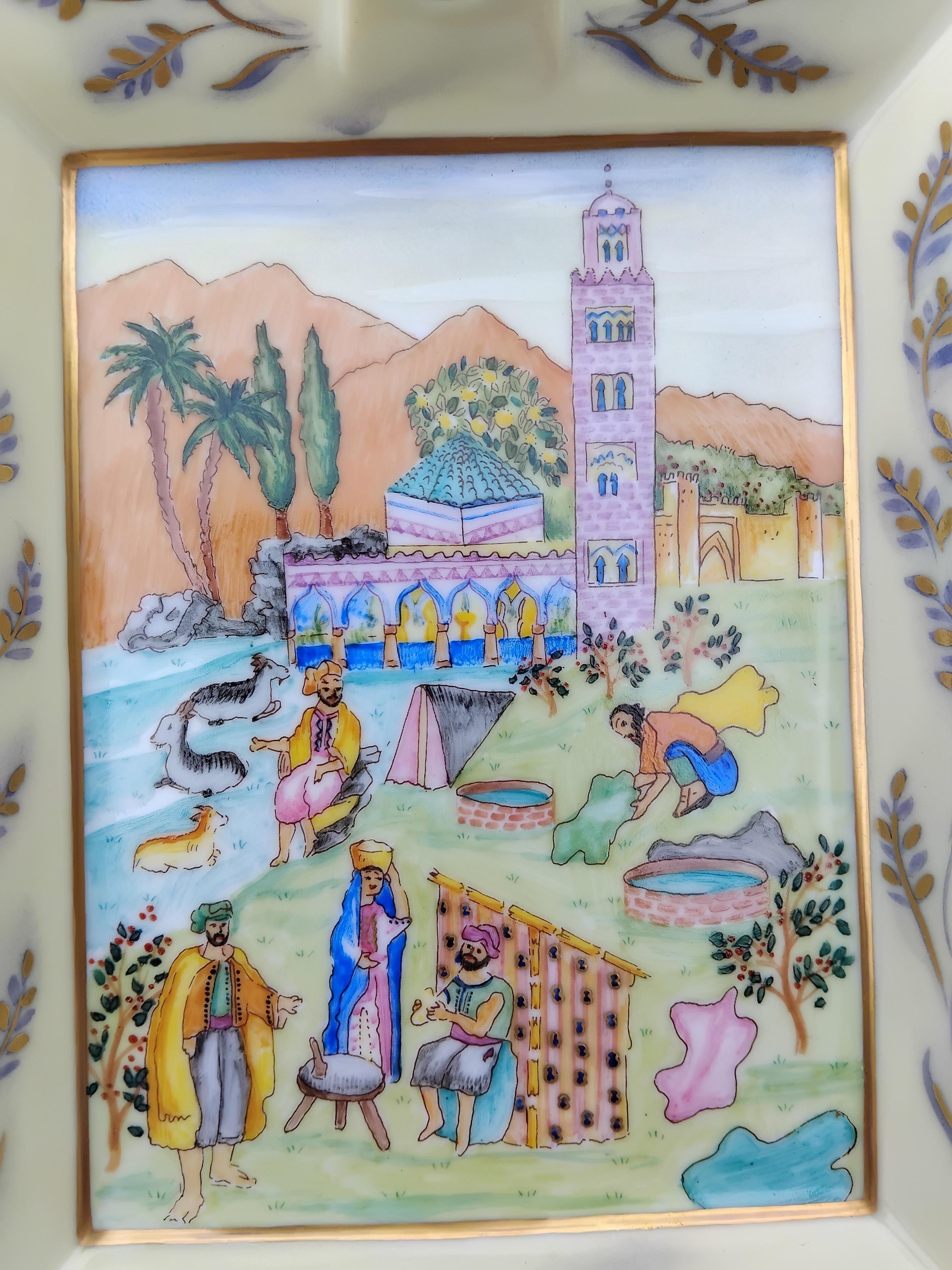 Gorgeous Authentic Hermès Ashtray

Extremely rare piece !

Print: oriental scene of life near a mosque, with characters, tanner, animals

Some places of the drawing are highlighted with gold, visible against the light, it's magnificent ! The same