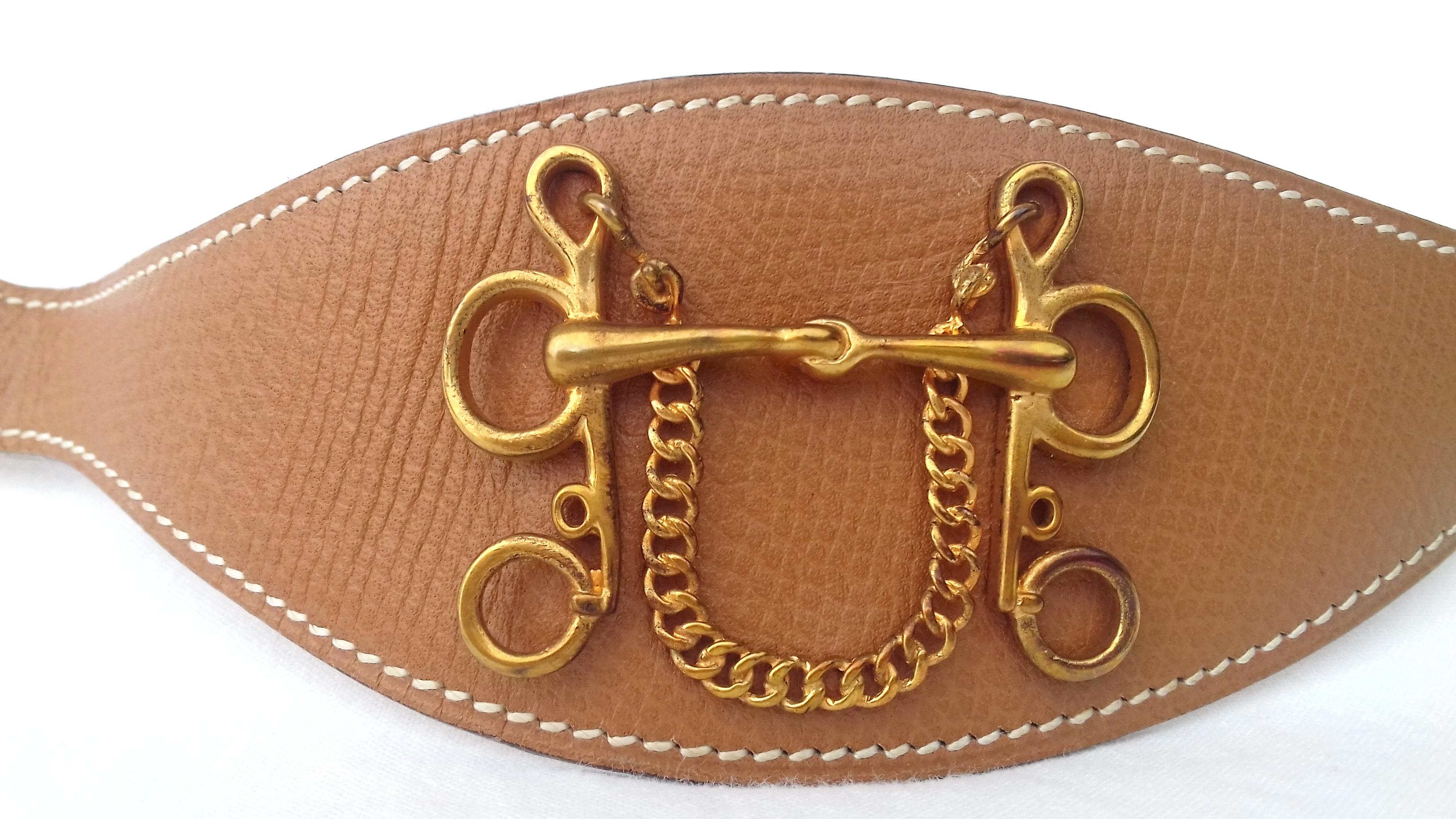 Rare Authentic Vintage Hermès Ornament

This piece of leather is designed to adorn the Hermès skirts and belts designed for this purpose (not included in sale)

The front is decorated with a gold metal H representing a horse's bit. Drawing also