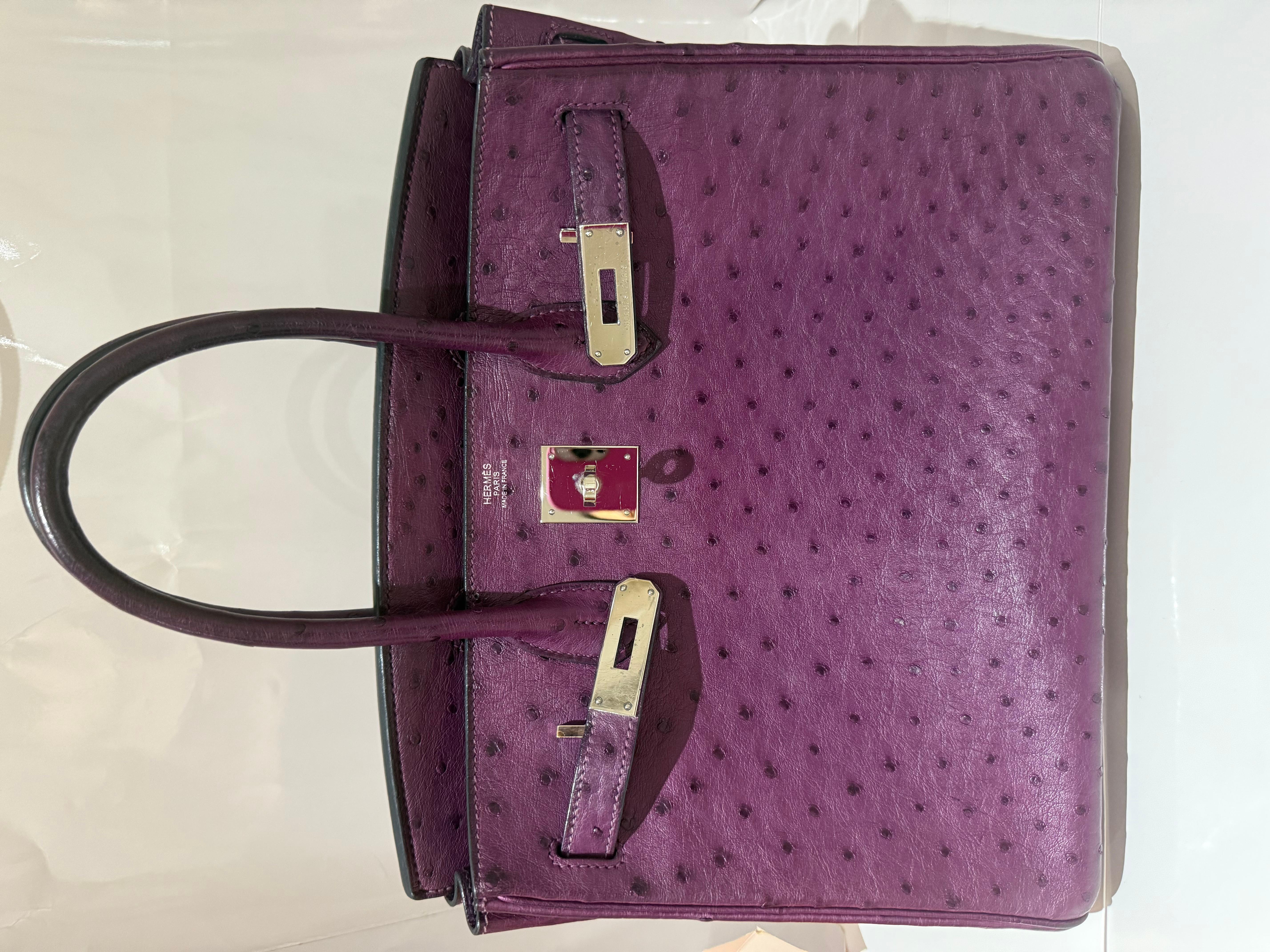 Hermes Ostrich Birkin 30 Violet colour handbag with Palladium hardware. This is a stunning rare birkin bag in very good condition. Marks in hardware and around the handle. N stamp. Comes with dustbag and box. 

The Twilly and rodeo can be purchased