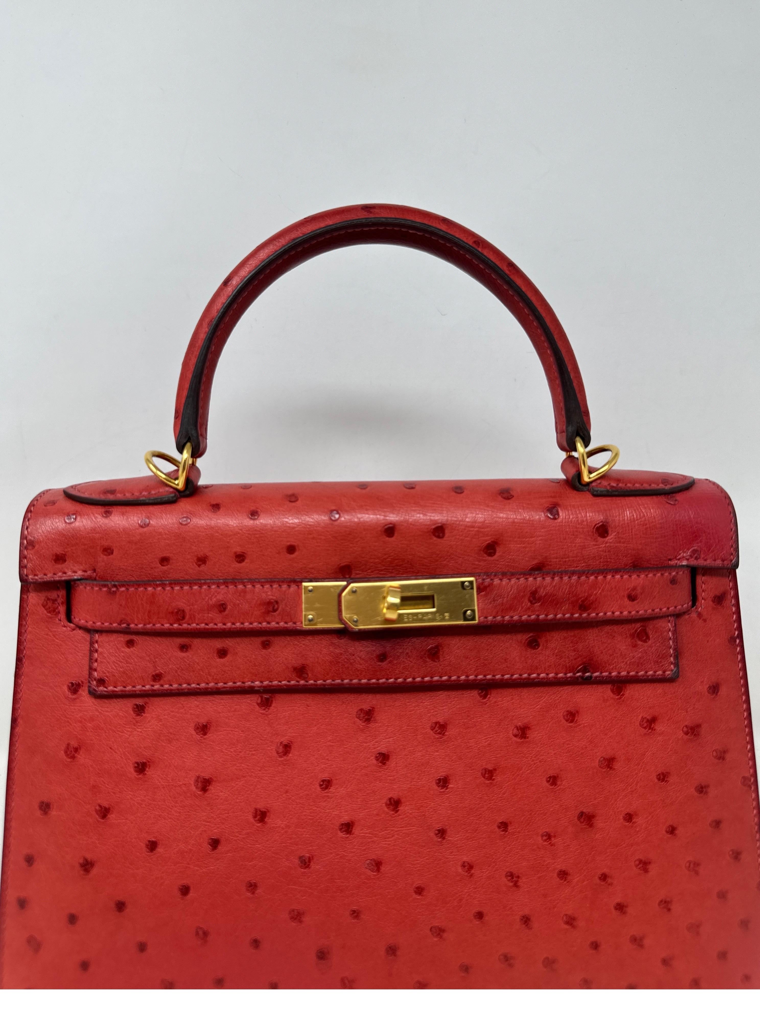 Hermes Ostrich Kelly 28 Bag. Beautiful ostrich leather exotic bag. Rare Kelly in very good condition. Interior clean. Missing clochette and keys. Has strap and dust bag. Pretty red brique color. Gold hardware. Great collector's bag. Guaranteed