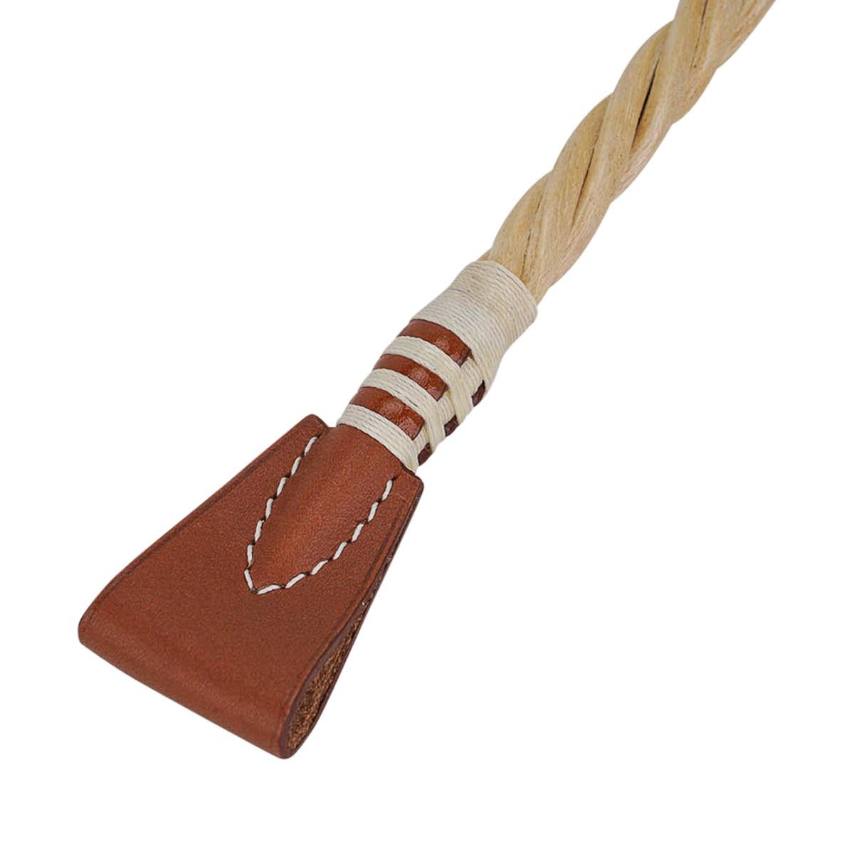 Mightychic offers a rare Hermes Paddock Cravache riding crop bag charm featured in Fauve Vache Hunter leather.
Beautifully detailed hackberry wood.
Stamped Hermes Paris Made in France on the leather.
Charming and playful she easily adorns a myriad