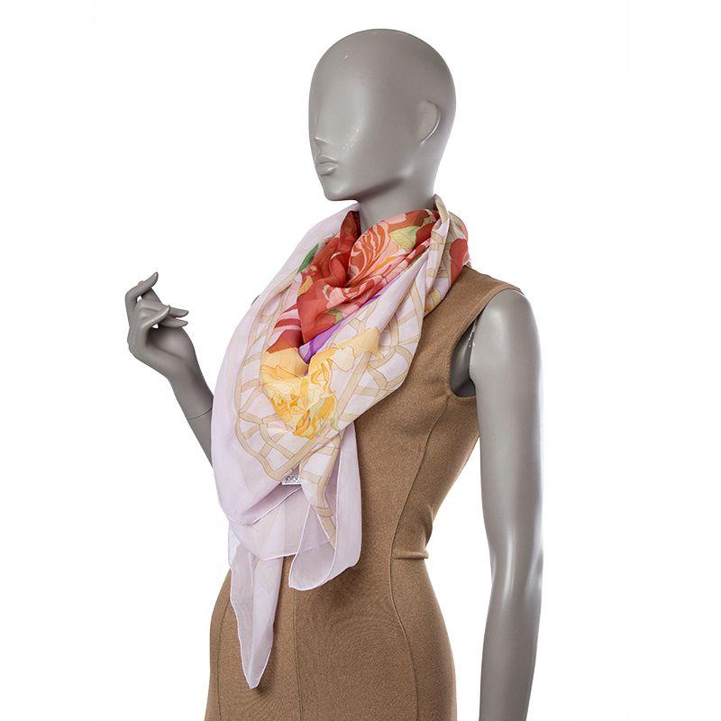 Hermes 'Roseraie 140 Mousseline' shawl in pale pink silk chiffon (100%) with details in red, lilac, beige, and yellow. Has been worn and is in excellent, virtually new condition.

Width 140cm (54.6in)
Height 140cm (54.6in)

