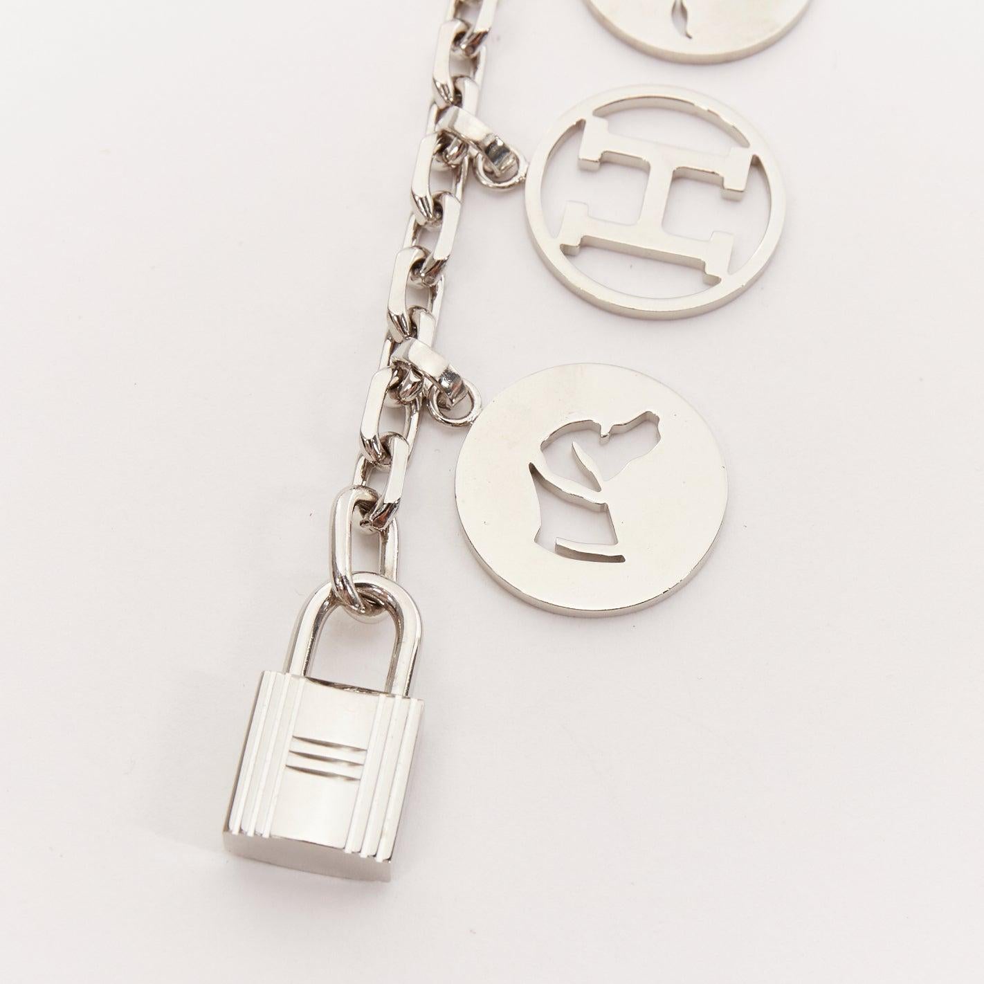 HERMES Palladium Breloque Olga Cadena lock H logo horse dog coin bag charm chain
Reference: AAWC/A01028
Brand: Hermes
Model: reloque Olga Cadena
Material: Metal
Color: Silver
Pattern: Solid
Closure: Lobster Clasp
Extra Details: The charms are Cadena
