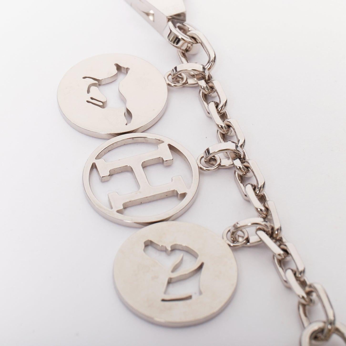 HERMES Palladium Breloque Olga Cadena lock H logo horse dog coin bag charm chain
Reference: TGAS/F00301
Brand: Hermes
Model: Breloque Olga Cadena
Material: Metal
Color: Silver
Pattern: Solid
Closure: Lobster Clasp
Extra Details: The charms are