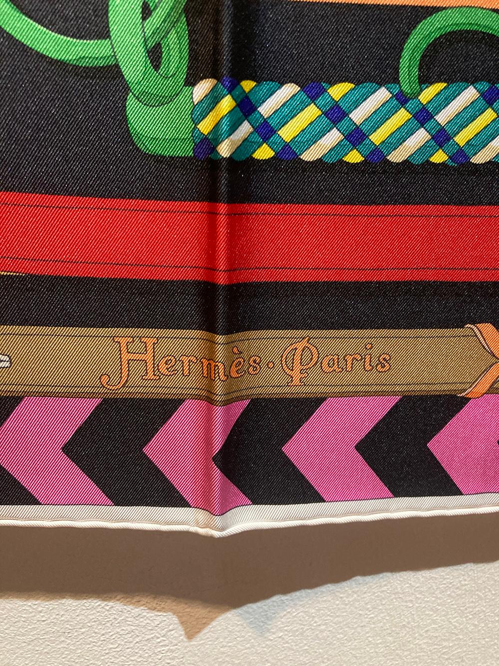 Hermes Panoplie Equestre Silk Scarf in excellent like-new condition. Original silk screen design c2020 by Virginie Jamin features a beautiful multicolor assortment of horse dressing accessories in green, red, blue, yellow and cream over a black