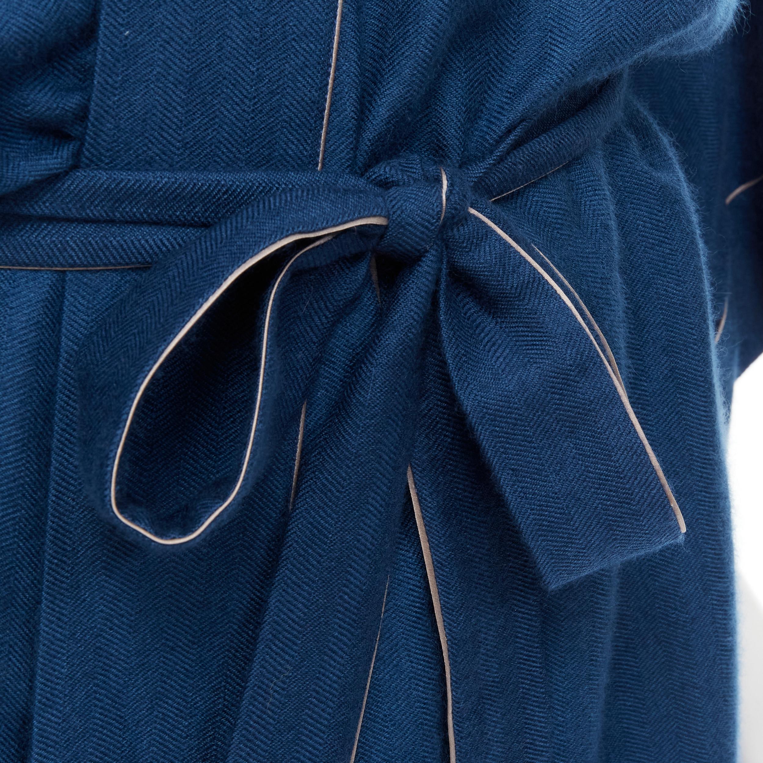 HERMES Paris 100% cashmere hand woven suede leather H logo belted robe L 
Reference: AEMA/A00044 
Brand: Hermes 
Material: Cashmere 
Color: Blue 
Pattern: Solid 
Closure: Belt 
Extra Detail: 100% cashmere. Handwoven in Nepal. Silver silk piping.