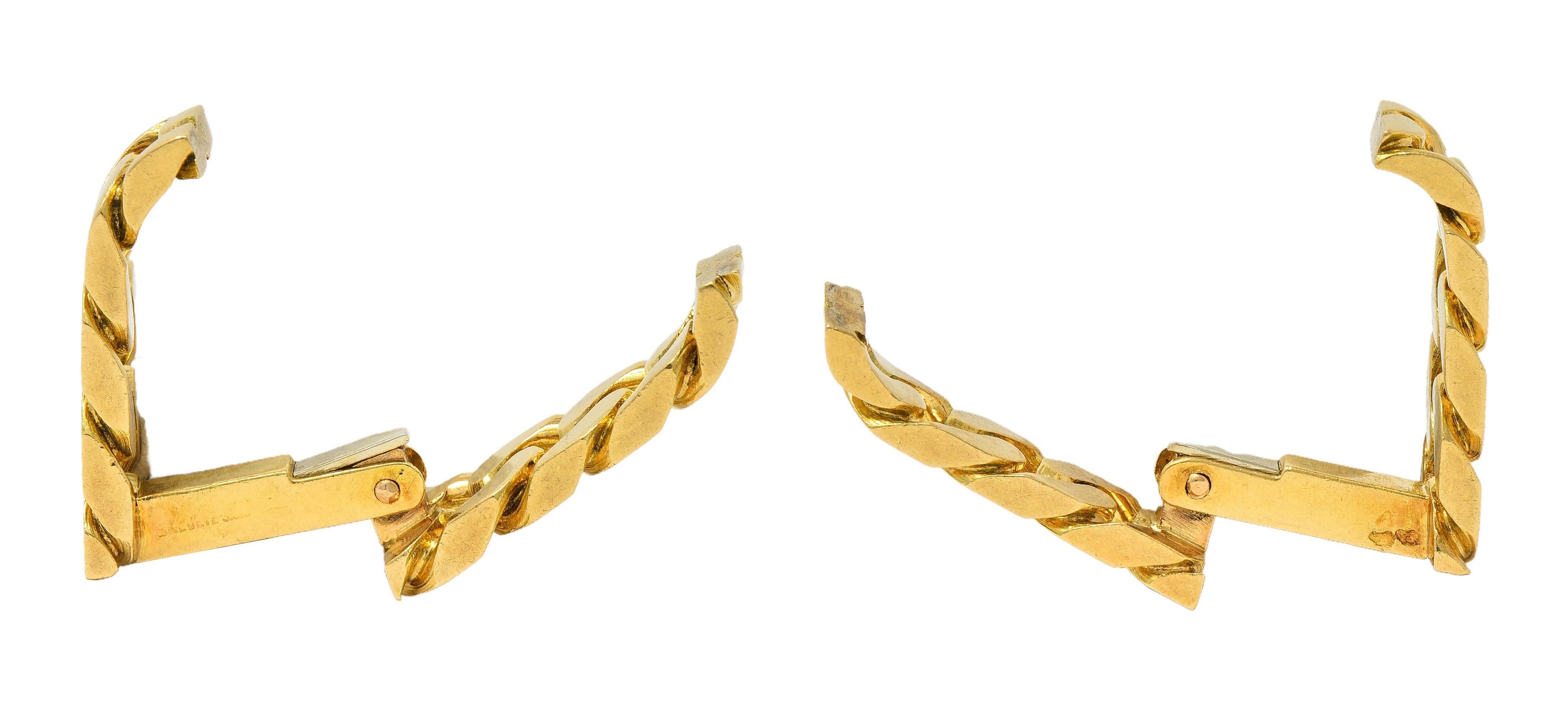 Stirrup-style cufflinks feature hinged curb link pattern 
With high polish finish
Fully signed for Hermès Paris 
Circa: 1970s
With French assay marks for 18 karat gold 
Measures: 3/4 x 11/16 inch
Total weight: 14.4 grams
Stock Number: We-13048