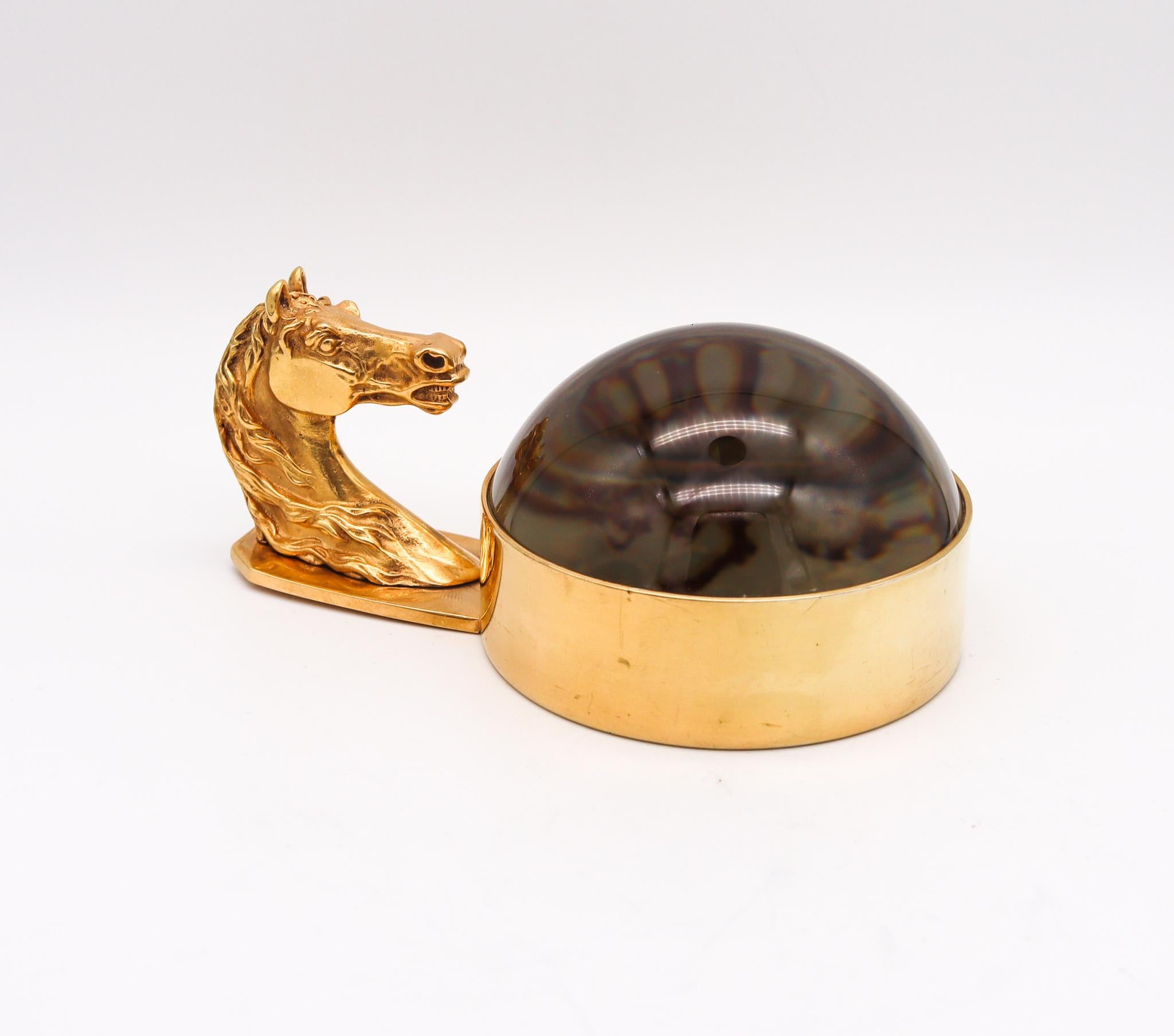 Desk magnifier glass designed by Hermes.

Fabulous and highly decorative piece, created in Paris, France by the house of Hermes, back in the 1960. This useful horse-profile paper weight and magnifier glass is rare and has been carefully crafted in