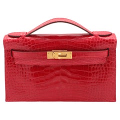Hermès París 2017 Kelly Pochette en aligátor braise con herrajes dorados juego completo