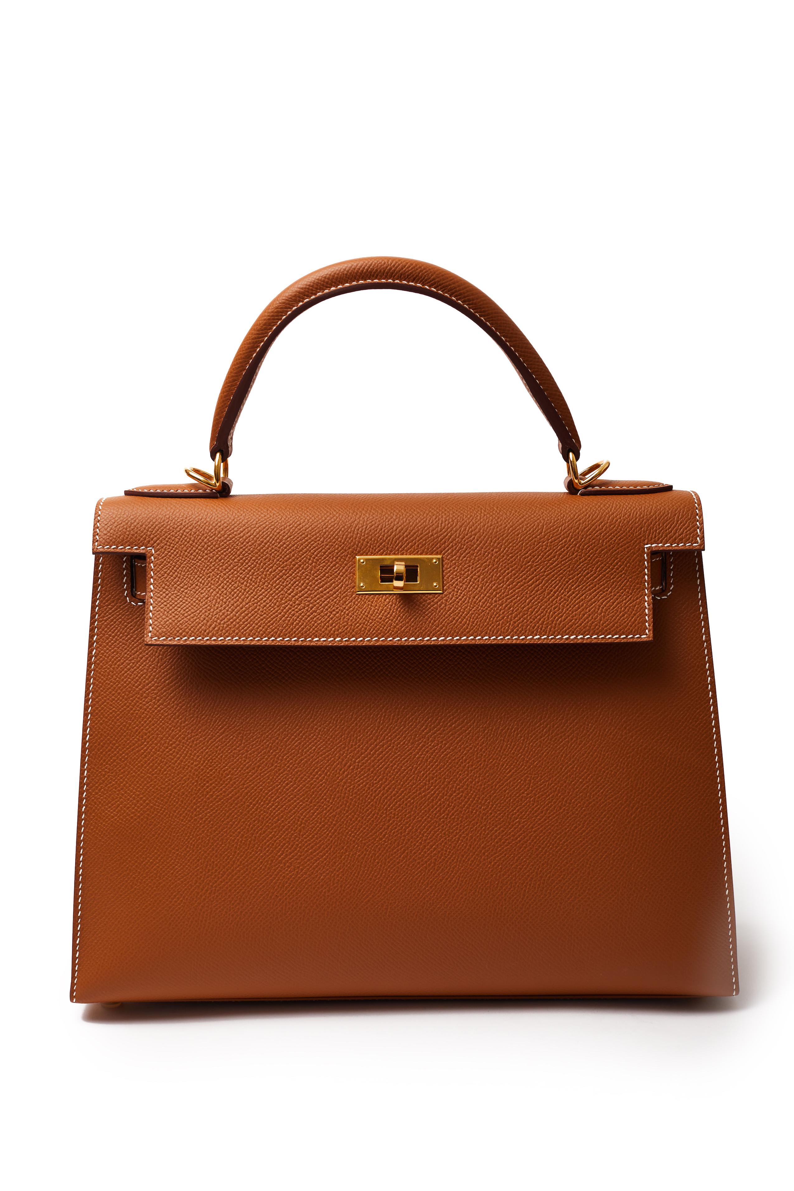 The grand dame of Hermès bags, this Kelly 28 in Gold Veau Epsom leather is in immaculate, unused condition. Featuring gold hardware, this is the perfect neutral shade in a versatile size that works for day or evening. Comes with original box,