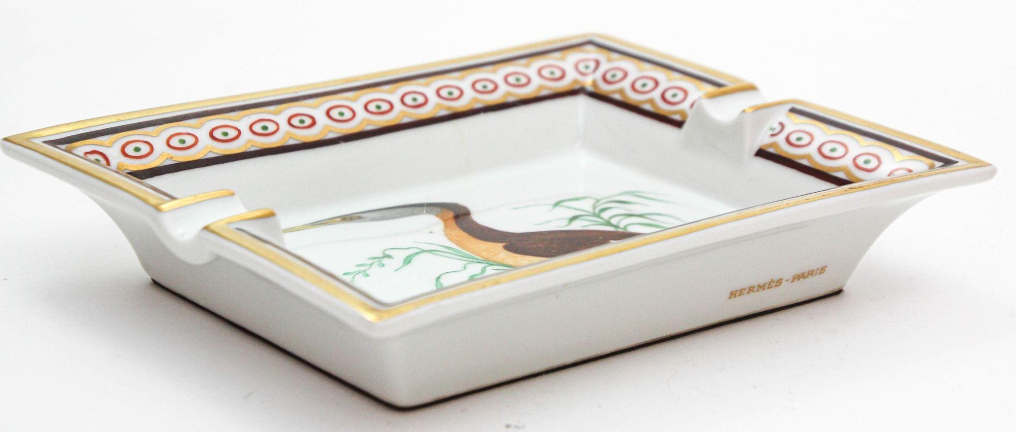 Hermès Paris porcelain ashtray in a rectangular shape featuring a Podicep bird, made in France.
It is marked 