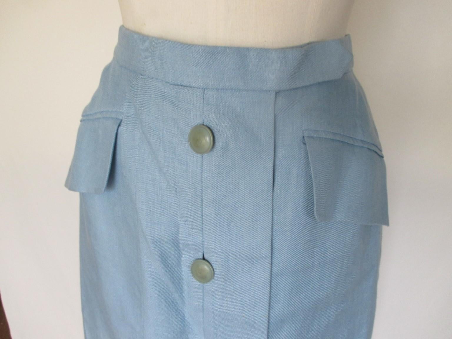 Beautiful Hermes Paris button down skirt made of 100% linen 
in the summer color, baby blue.

We offer more Hermes items, view our frontstore.

Details:
2 pockets
4 hermes logo buttons
Closing with 2 buttons and hook inside
2 extra Hermes logo