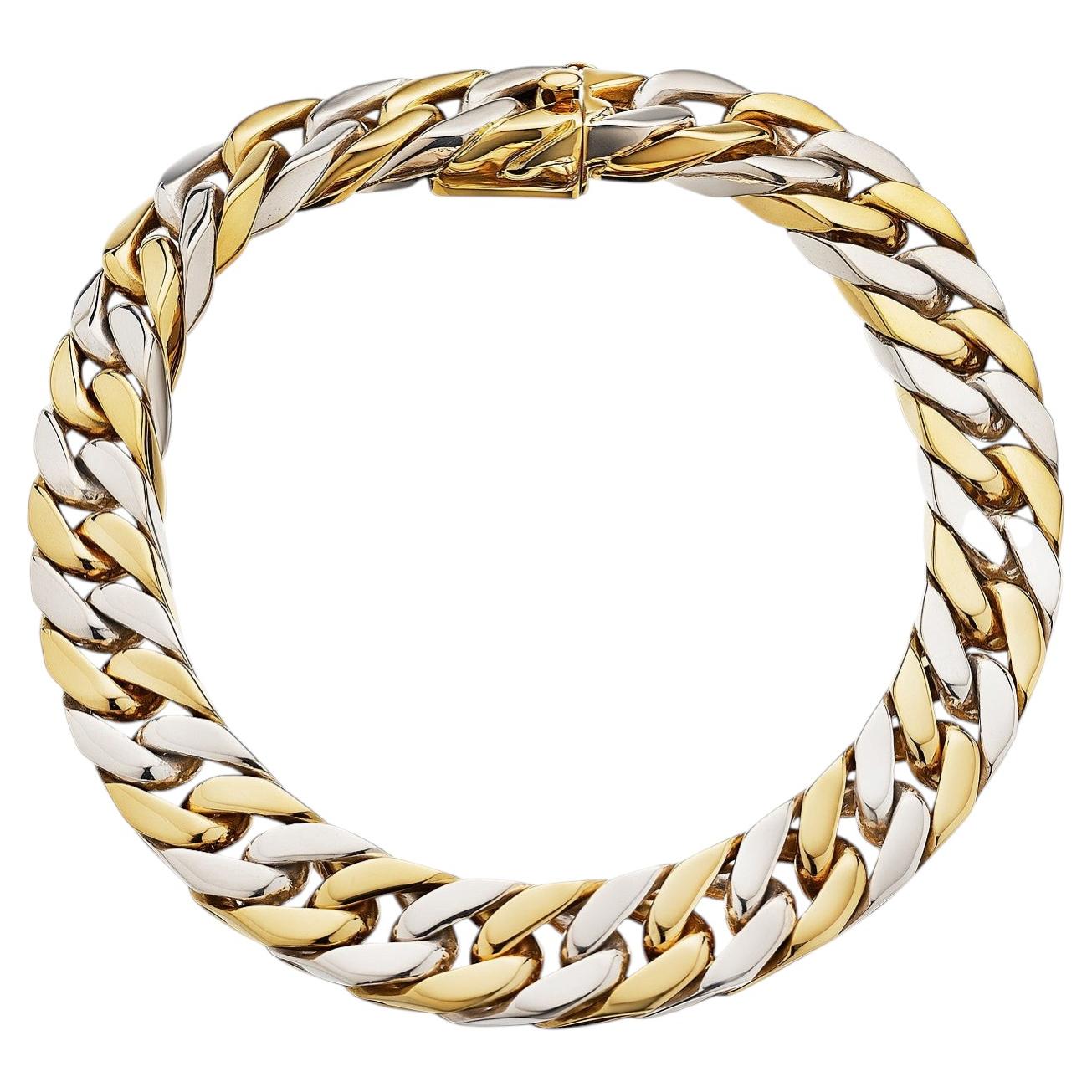 Bracciale Hermes Paris bicolore con maglie a catena dorate in stile modernista